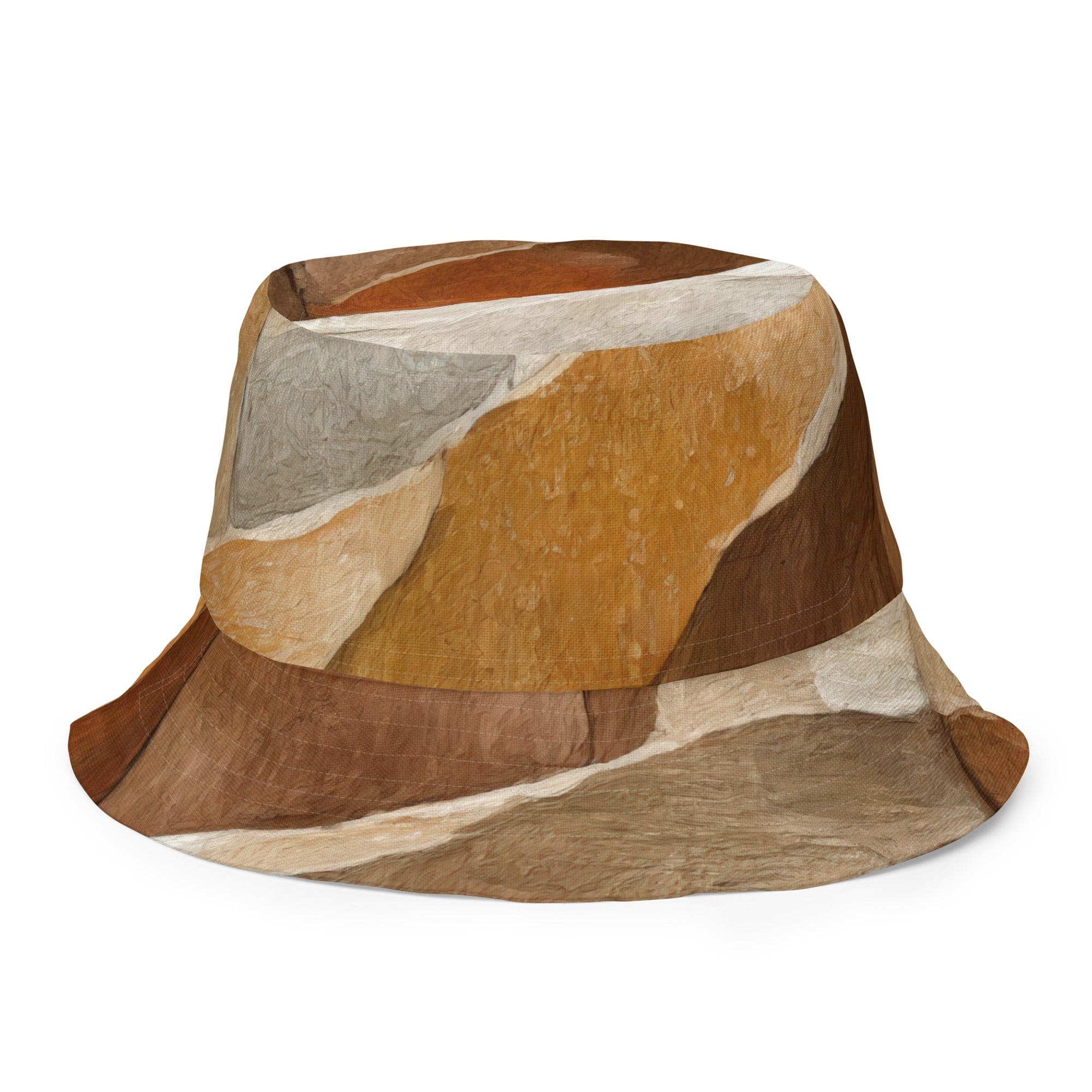 Reversible bucket hat featuring an abstract stone pattern, showcasing its stylish design and wide brim for sun protection.