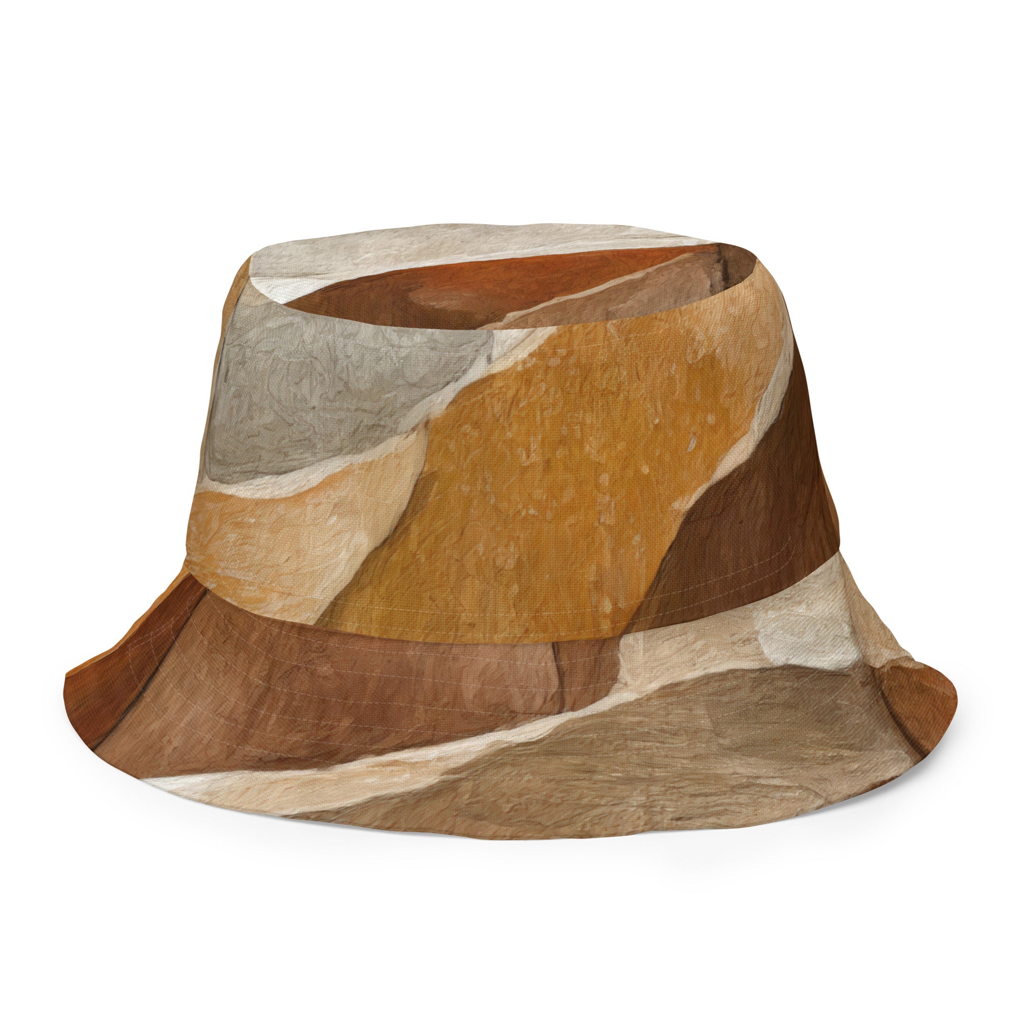 Reversible bucket hat featuring an abstract stone pattern, showcasing its stylish design and wide brim for sun protection.