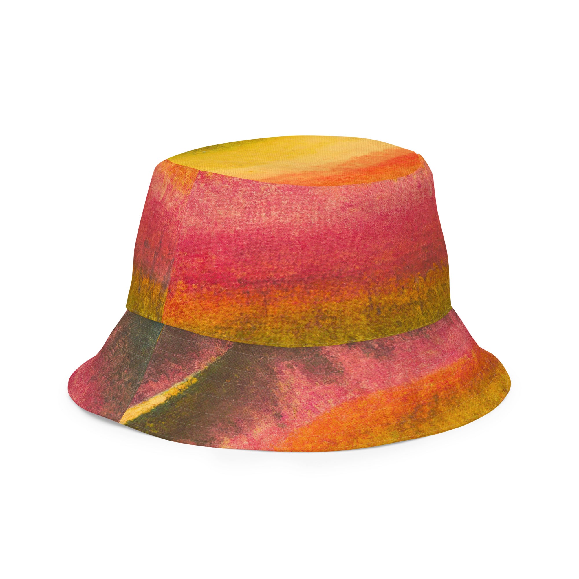 Reversible bucket hat featuring a watercolor abstract print, perfect for autumn and fall fashion, made from breathable polyester fabric.