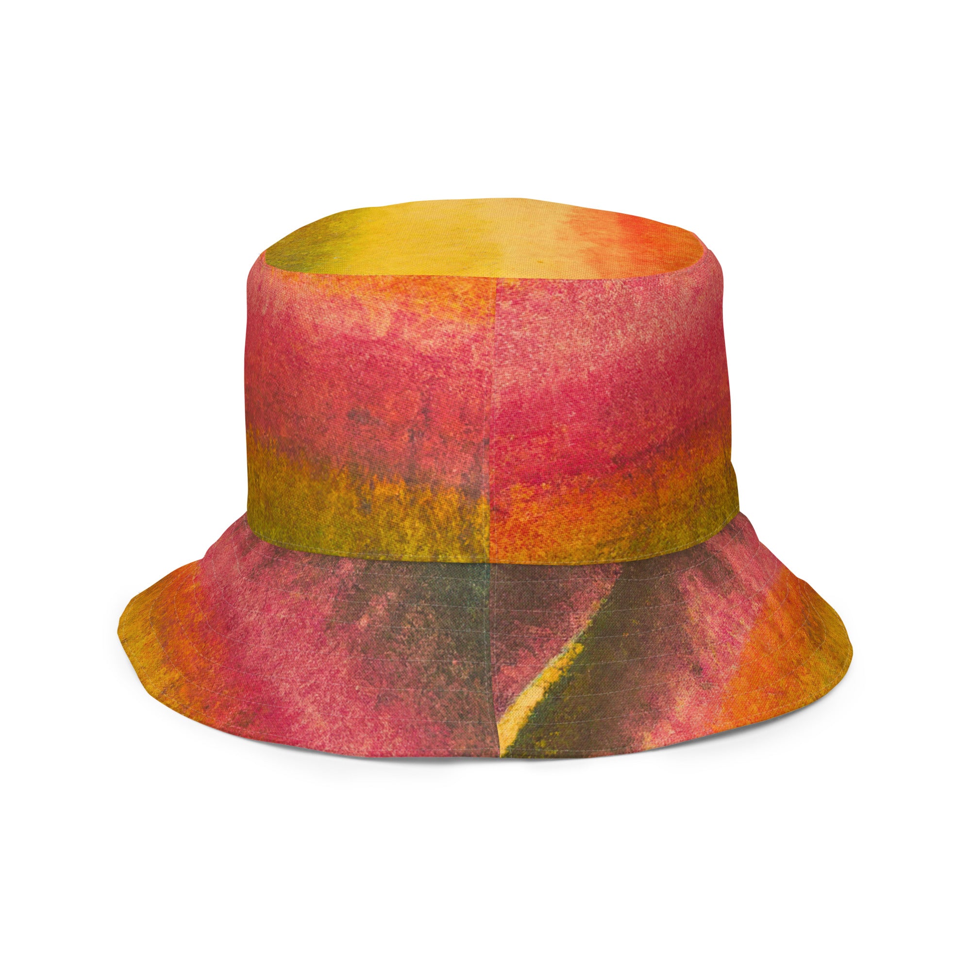 Reversible bucket hat featuring a watercolor abstract print, perfect for autumn and fall fashion, made from breathable polyester fabric.