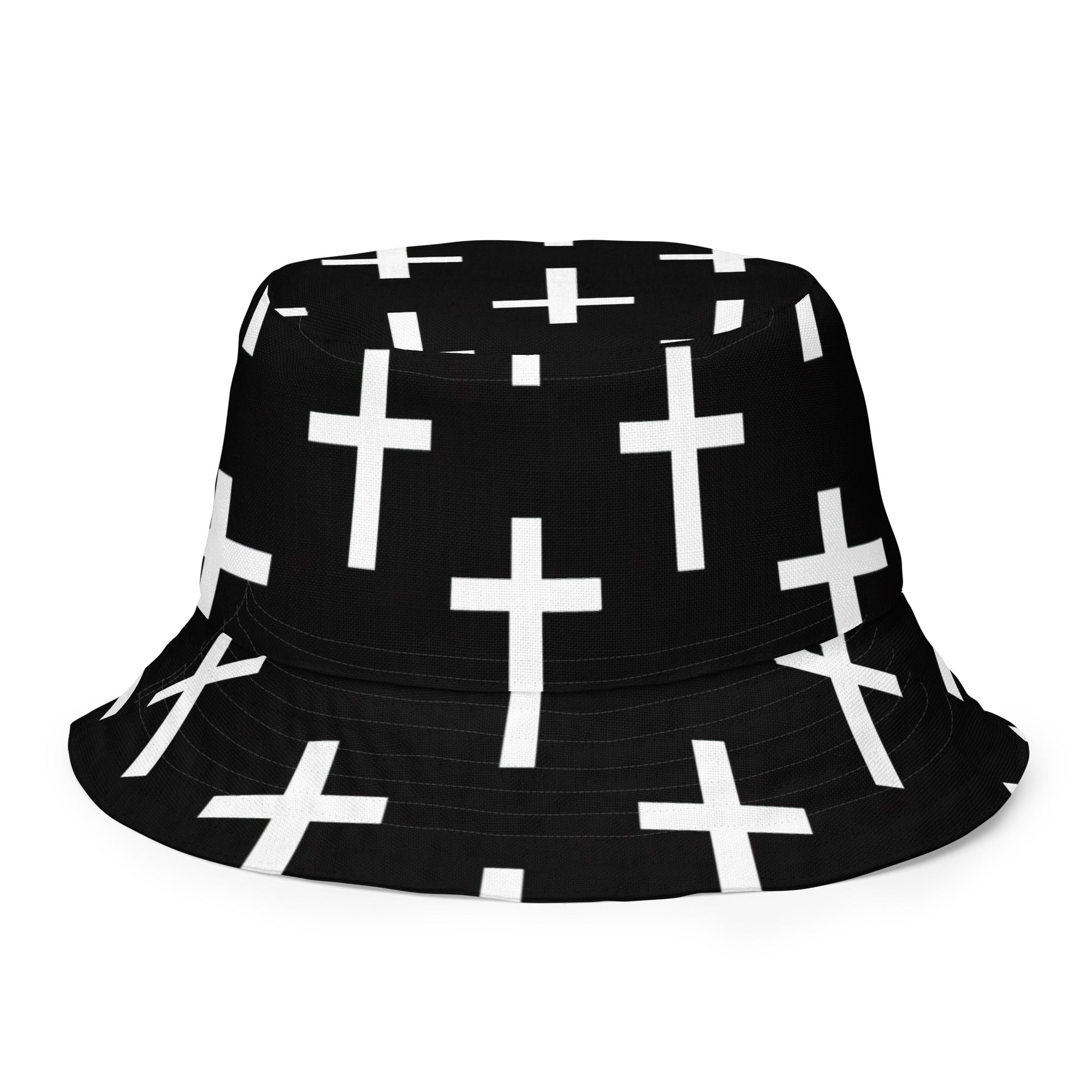 Reversible bucket hat featuring a black and white seamless cross print, showcasing its stylish design and premium fabric.