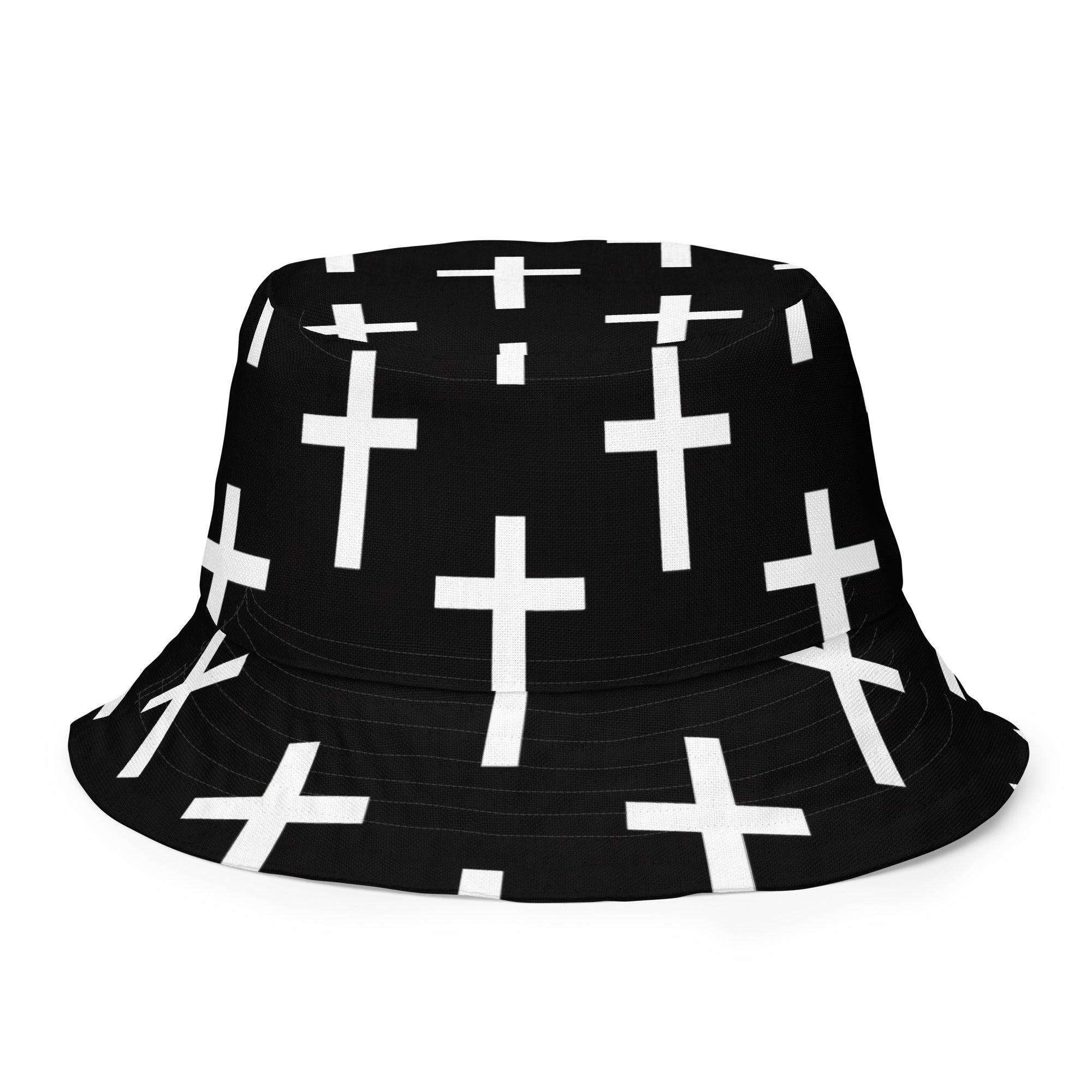 Reversible bucket hat featuring a black and white seamless cross print, showcasing its stylish design and premium fabric.