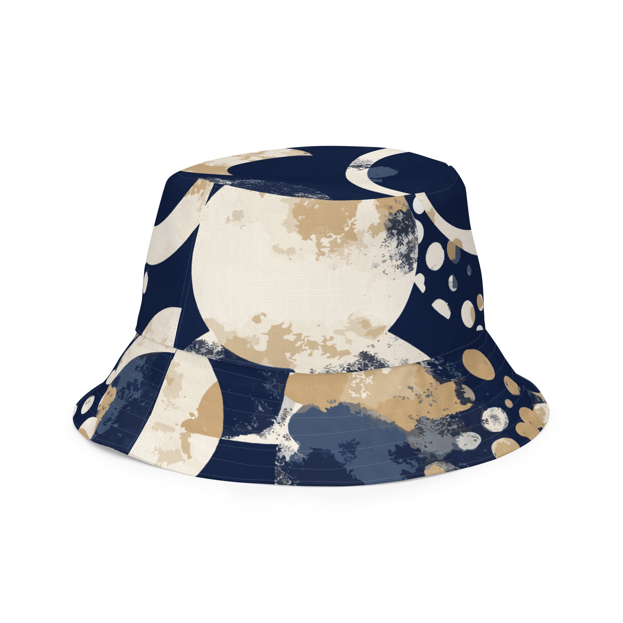 Reversible bucket hat featuring a blue and beige spotted print, showcasing both sides of the design.