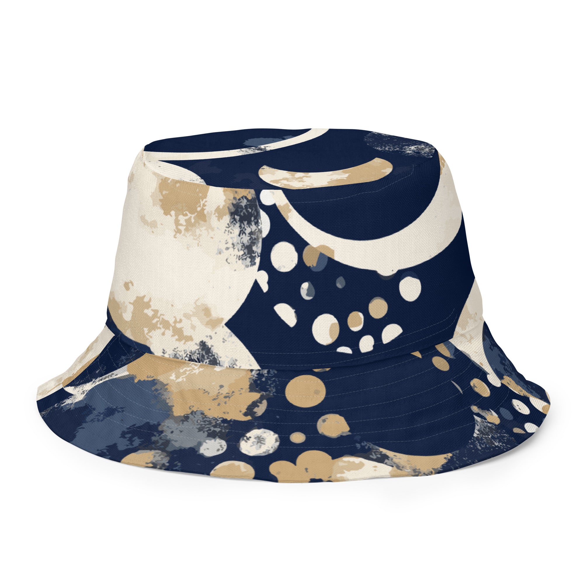 Reversible bucket hat featuring a blue and beige spotted print, showcasing both sides of the design.