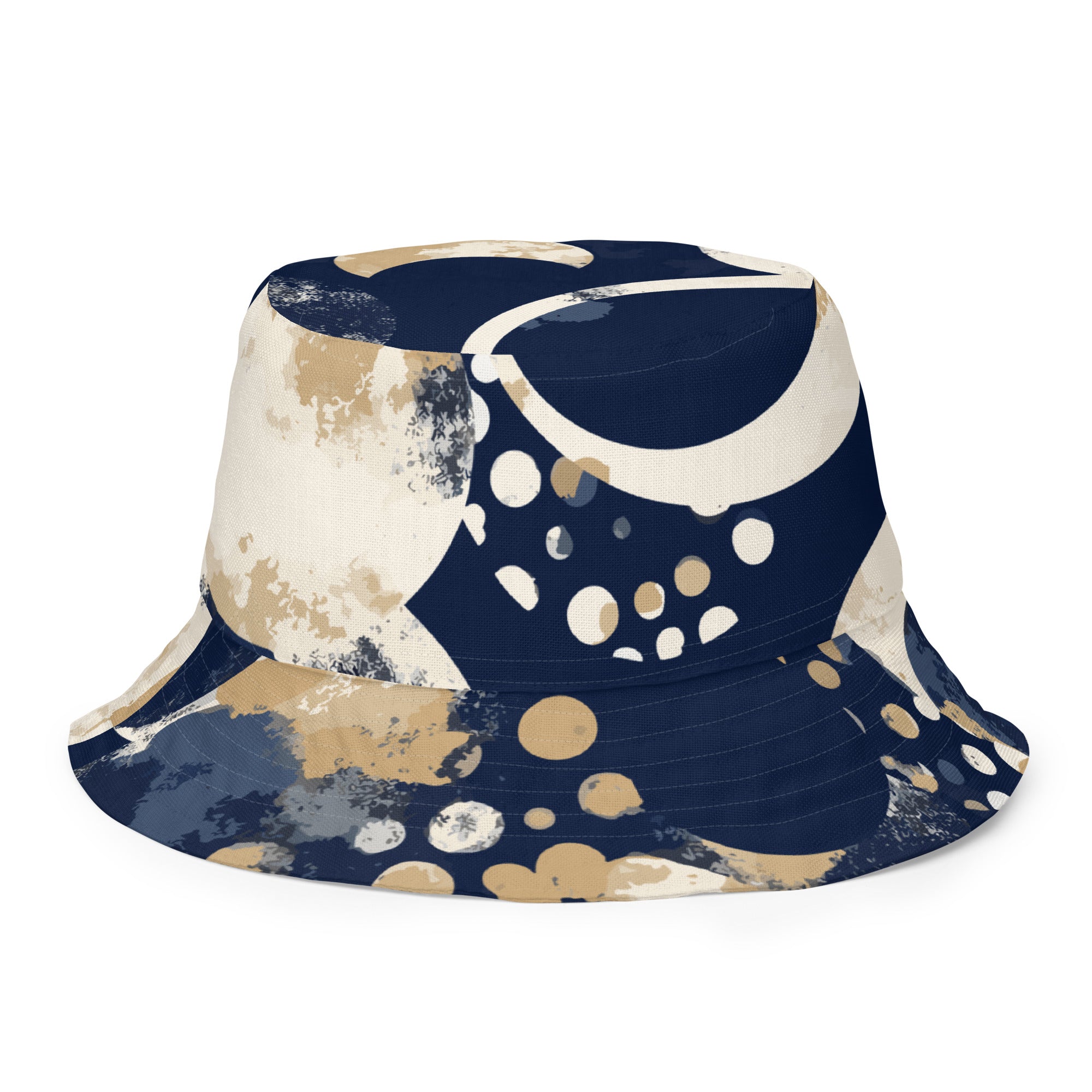 Reversible bucket hat featuring a blue and beige spotted print, showcasing both sides of the design.