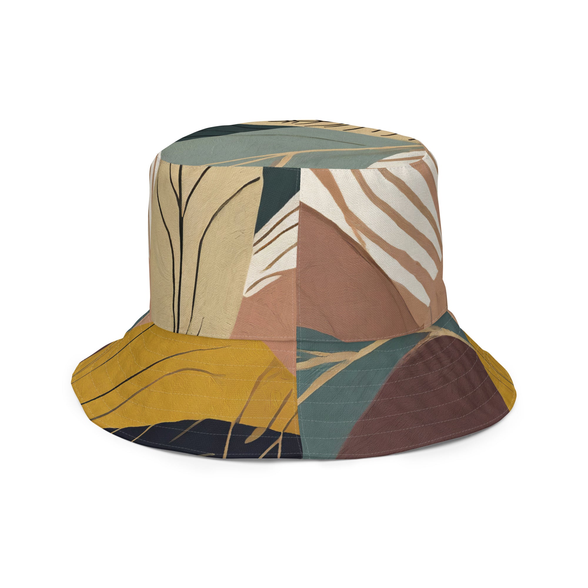 Reversible bucket hat featuring a boho style print, showcasing its dual-sided design and wide brim for sun protection.