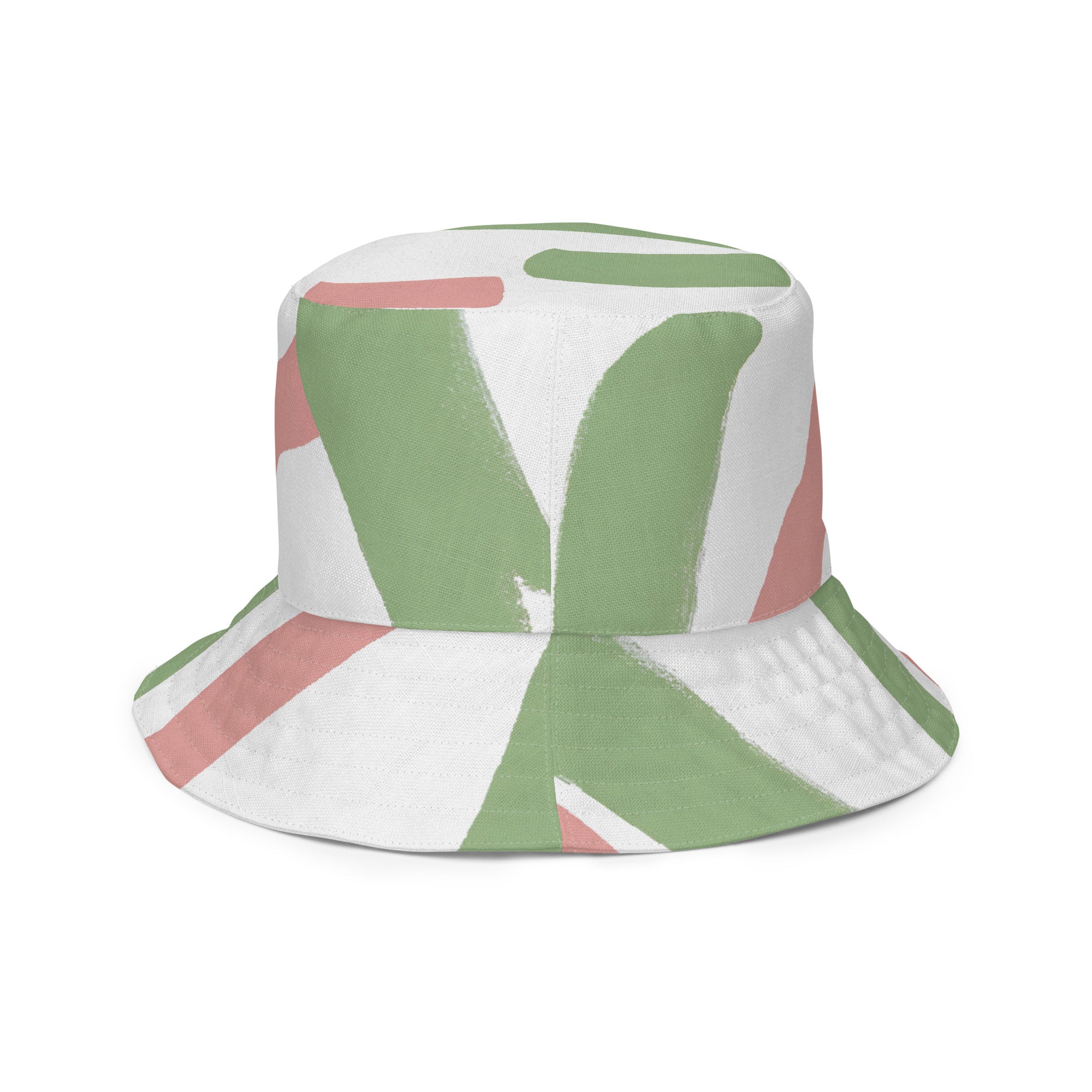 Reversible bucket hat featuring a green mauve abstract brush stroke pattern, showcasing its stylish design and breathable fabric.