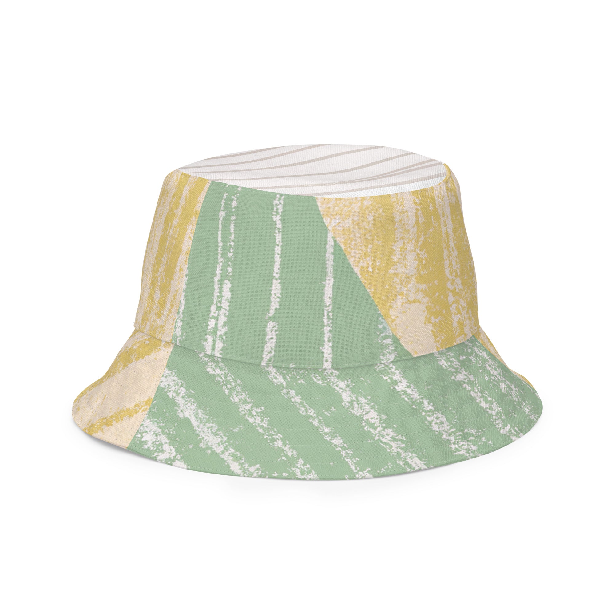 Reversible bucket hat featuring a mint green textured boho pattern, showcasing both sides of the design.