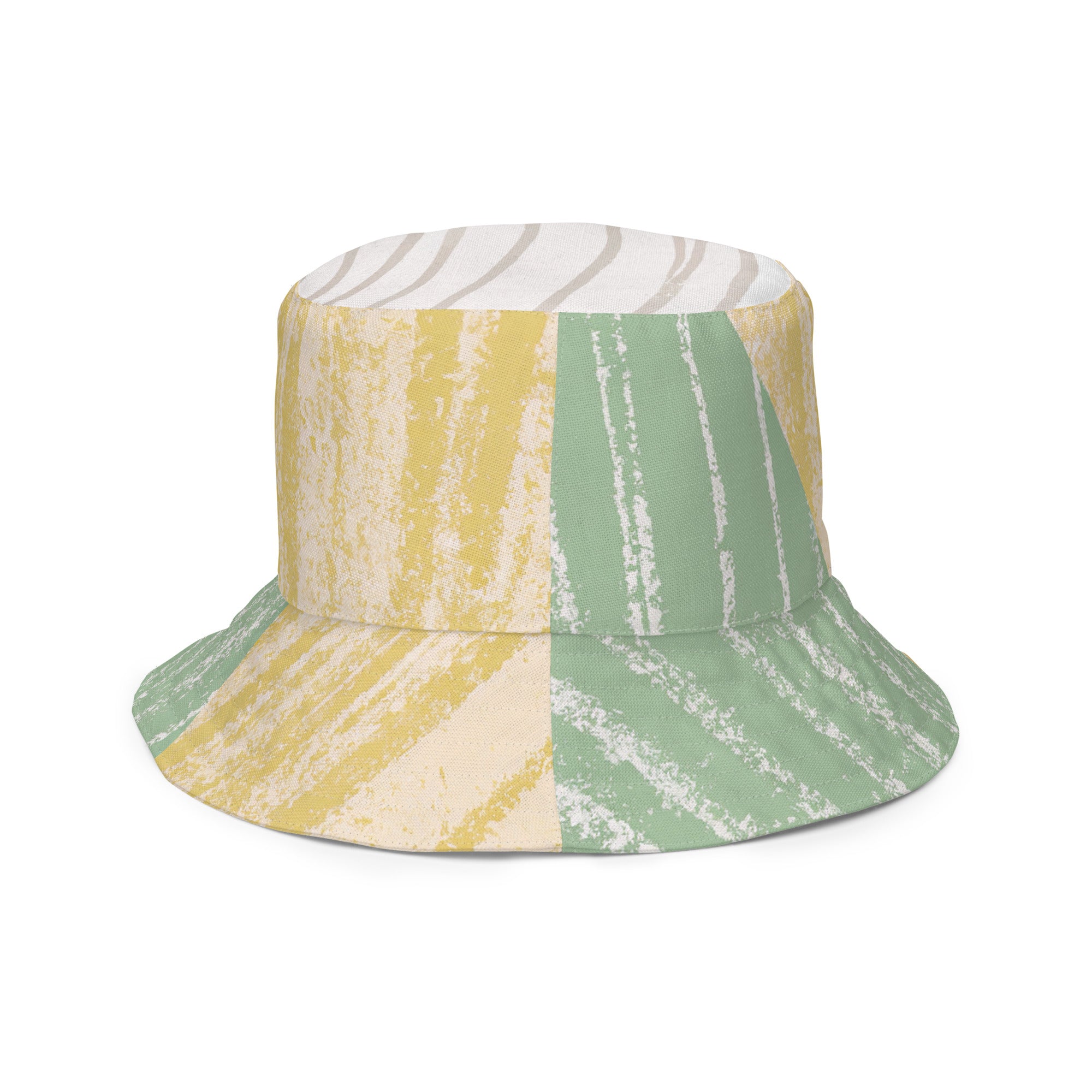 Reversible bucket hat featuring a mint green textured boho pattern, showcasing both sides of the design.