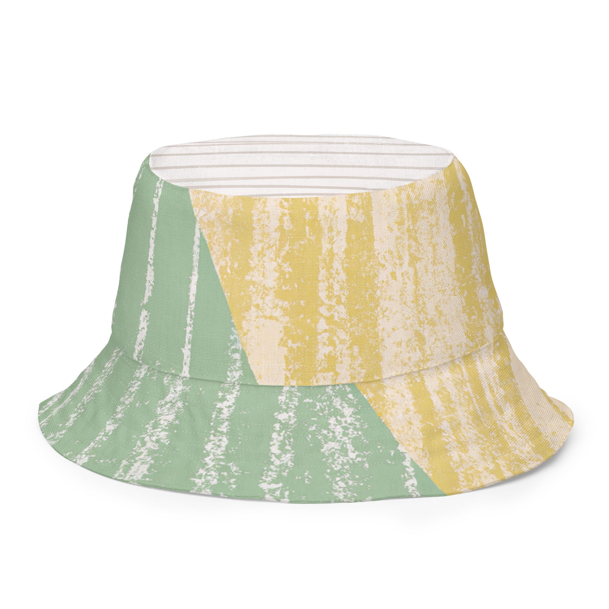 Reversible bucket hat featuring a mint green textured boho pattern, showcasing both sides of the design.