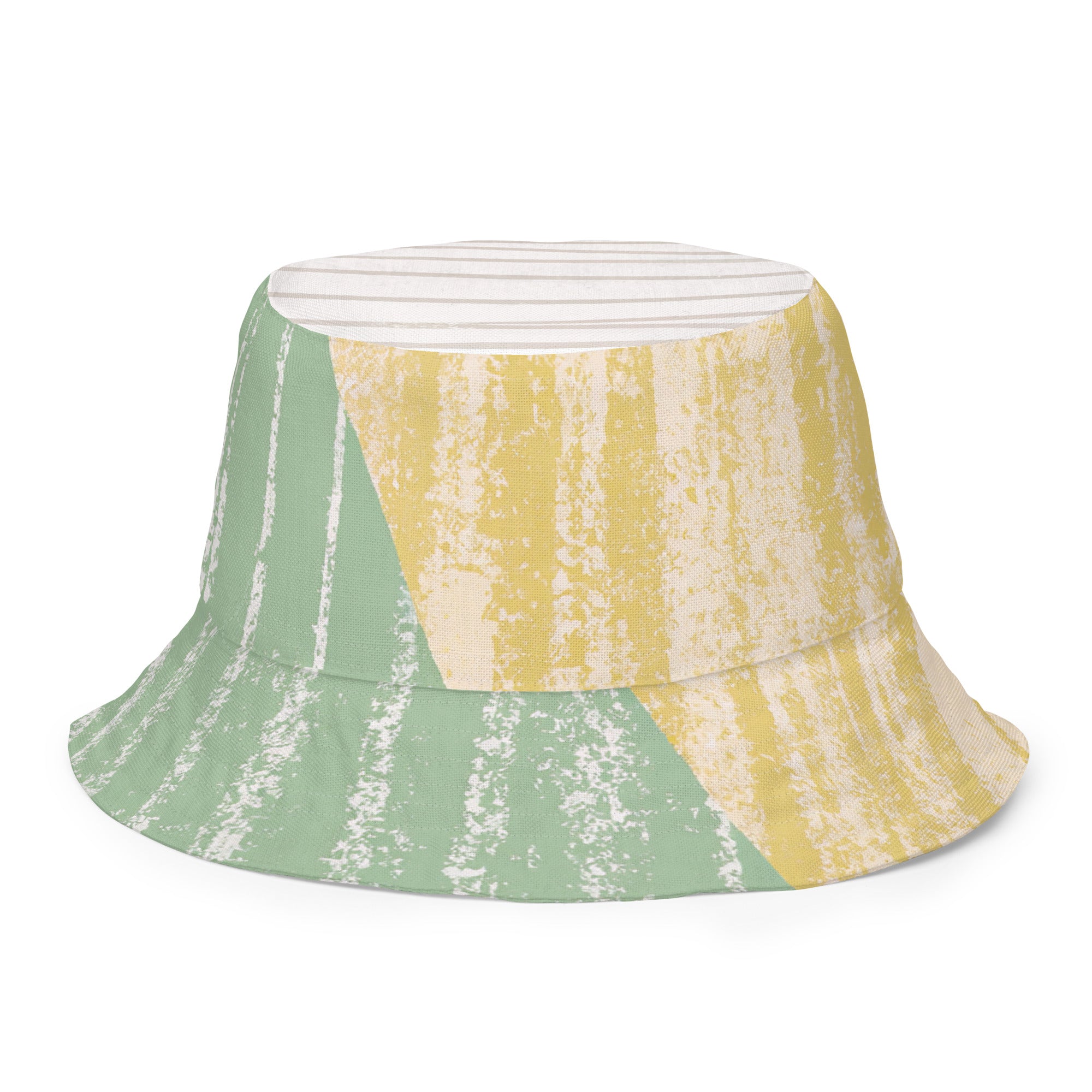 Reversible bucket hat featuring a mint green textured boho pattern, showcasing both sides of the design.