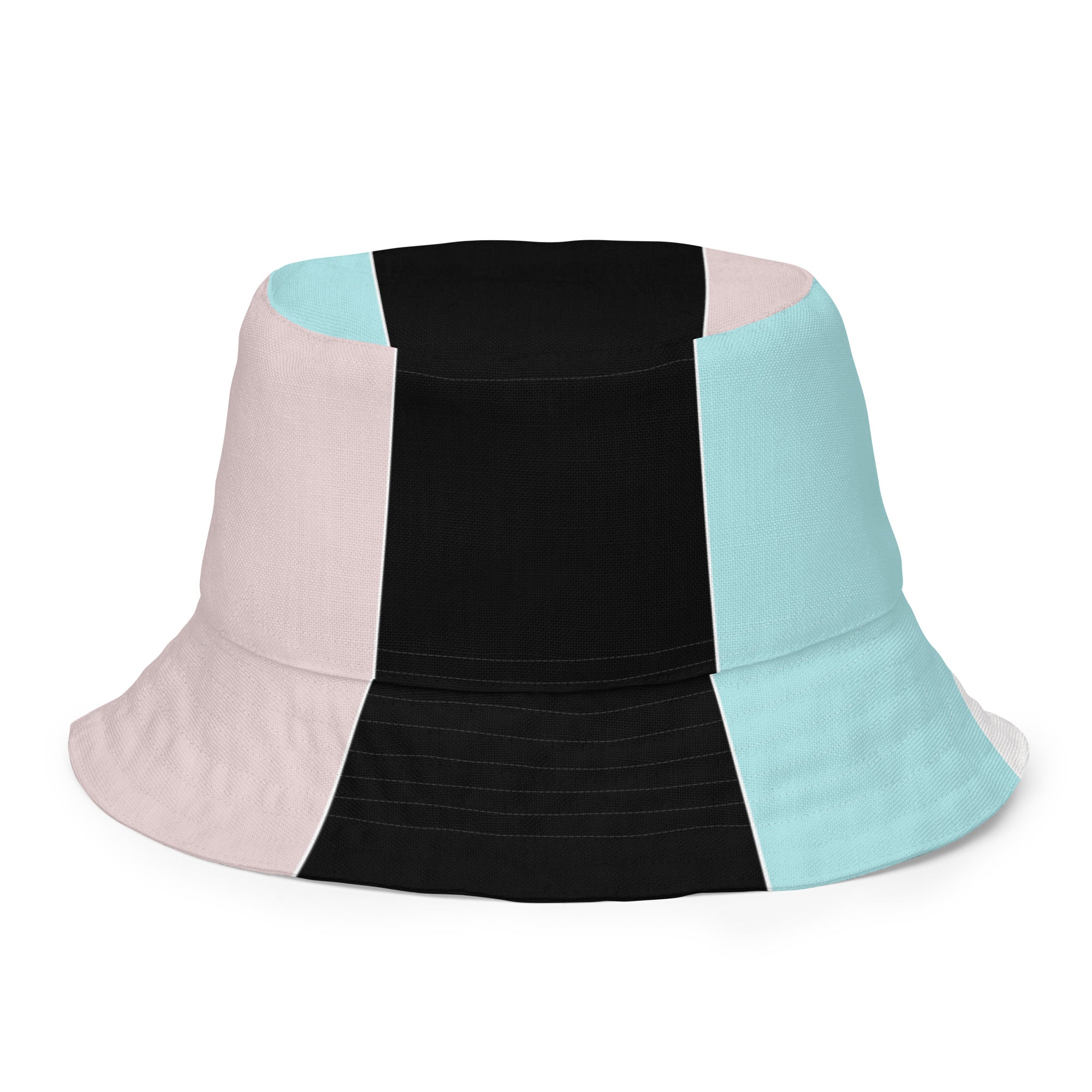 Reversible bucket hat featuring pastel pink, black, and blue colorblock design, showcasing both sides of the fabric.