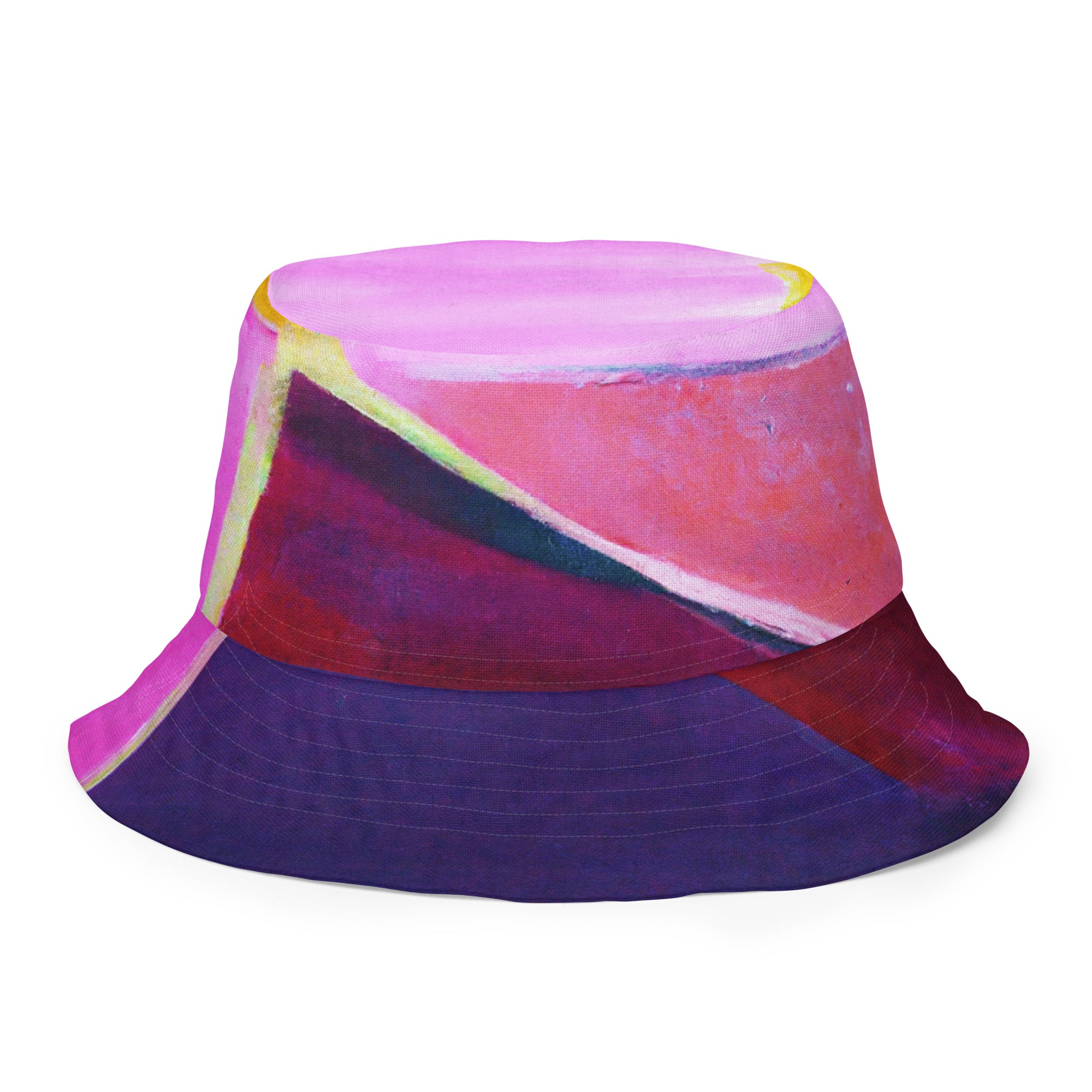 Reversible bucket hat featuring a pink and purple geometric pattern, showcasing both sides of the design.