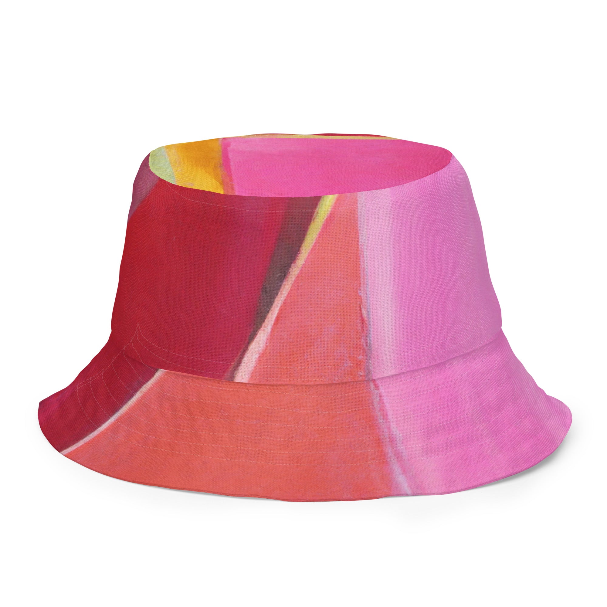 Reversible bucket hat featuring a pink mauve red geometric pattern, showcasing its stylish design and premium fabric.