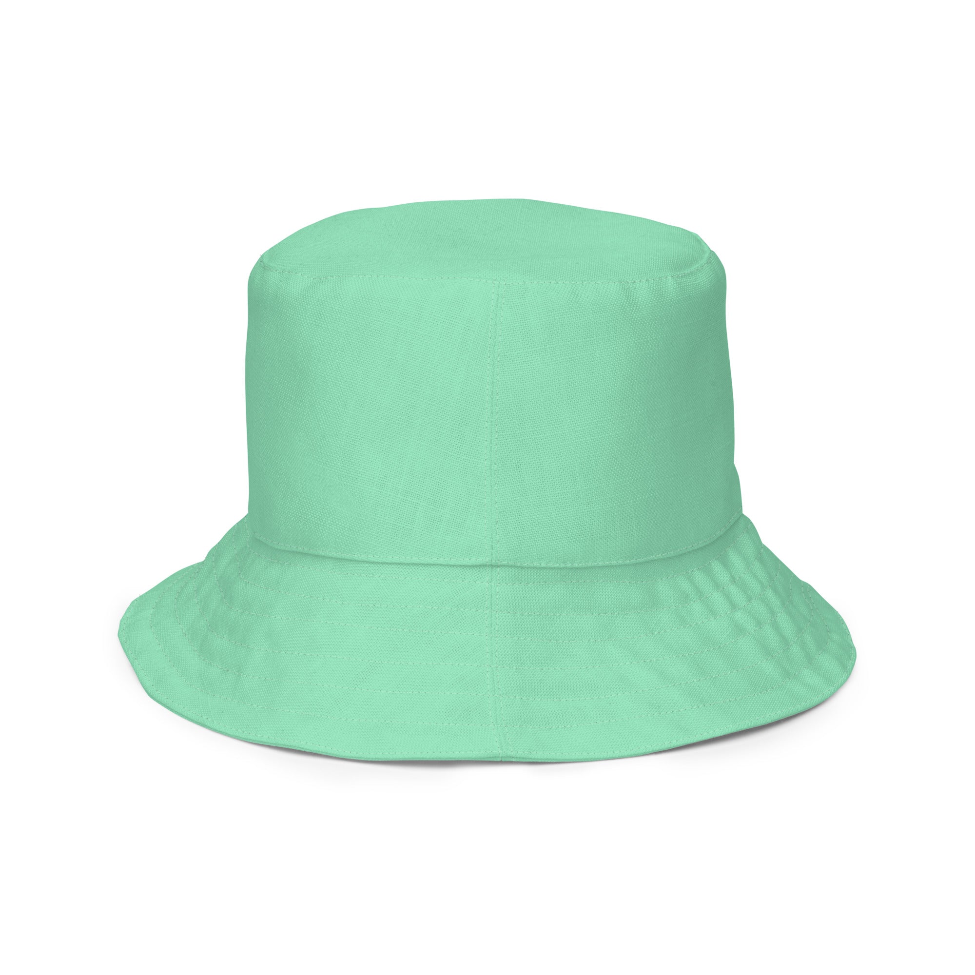 Reversible Bucket Hat in Seafoam Green, showcasing its dual-sided design and wide brim for sun protection.