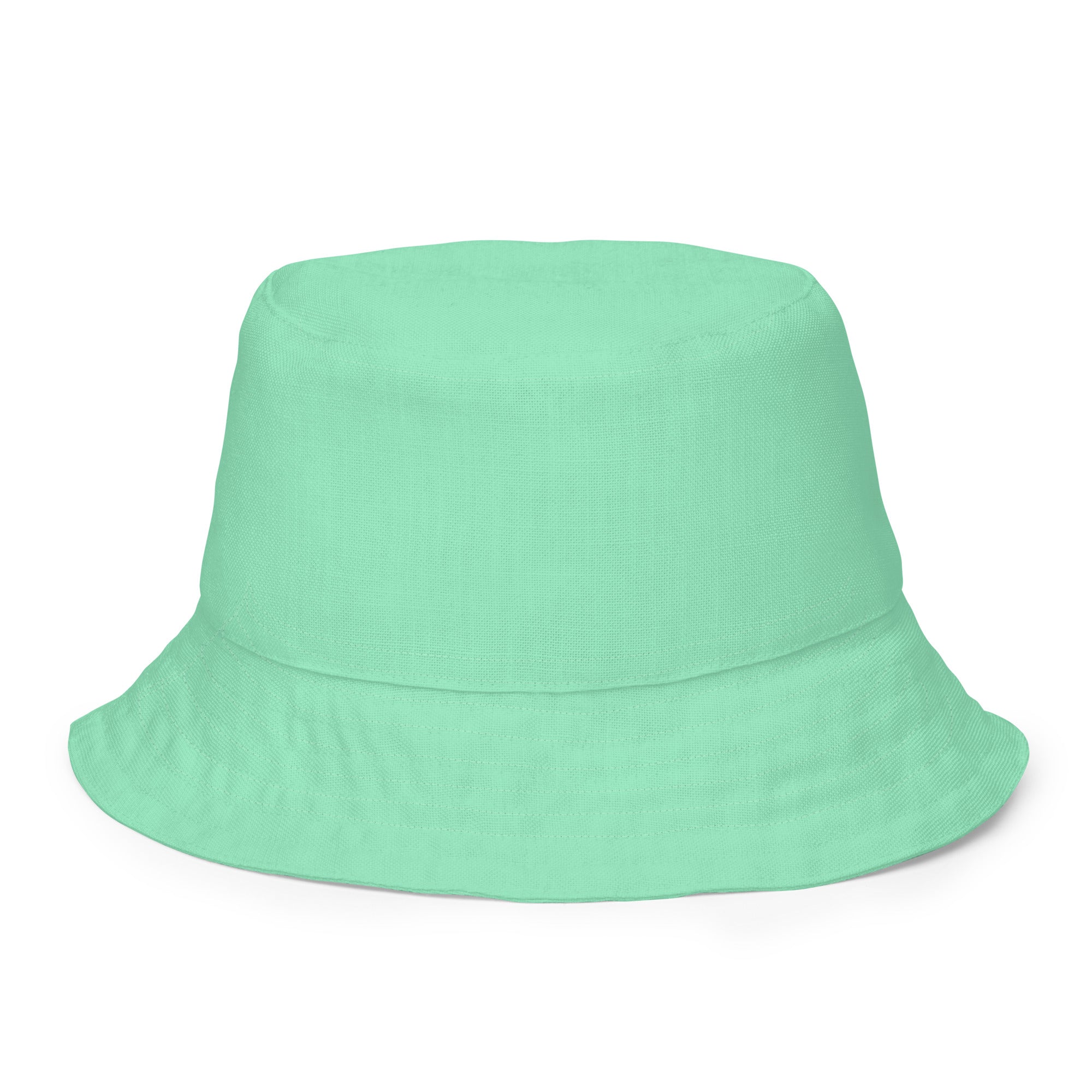 Reversible Bucket Hat in Seafoam Green, showcasing its dual-sided design and wide brim for sun protection.