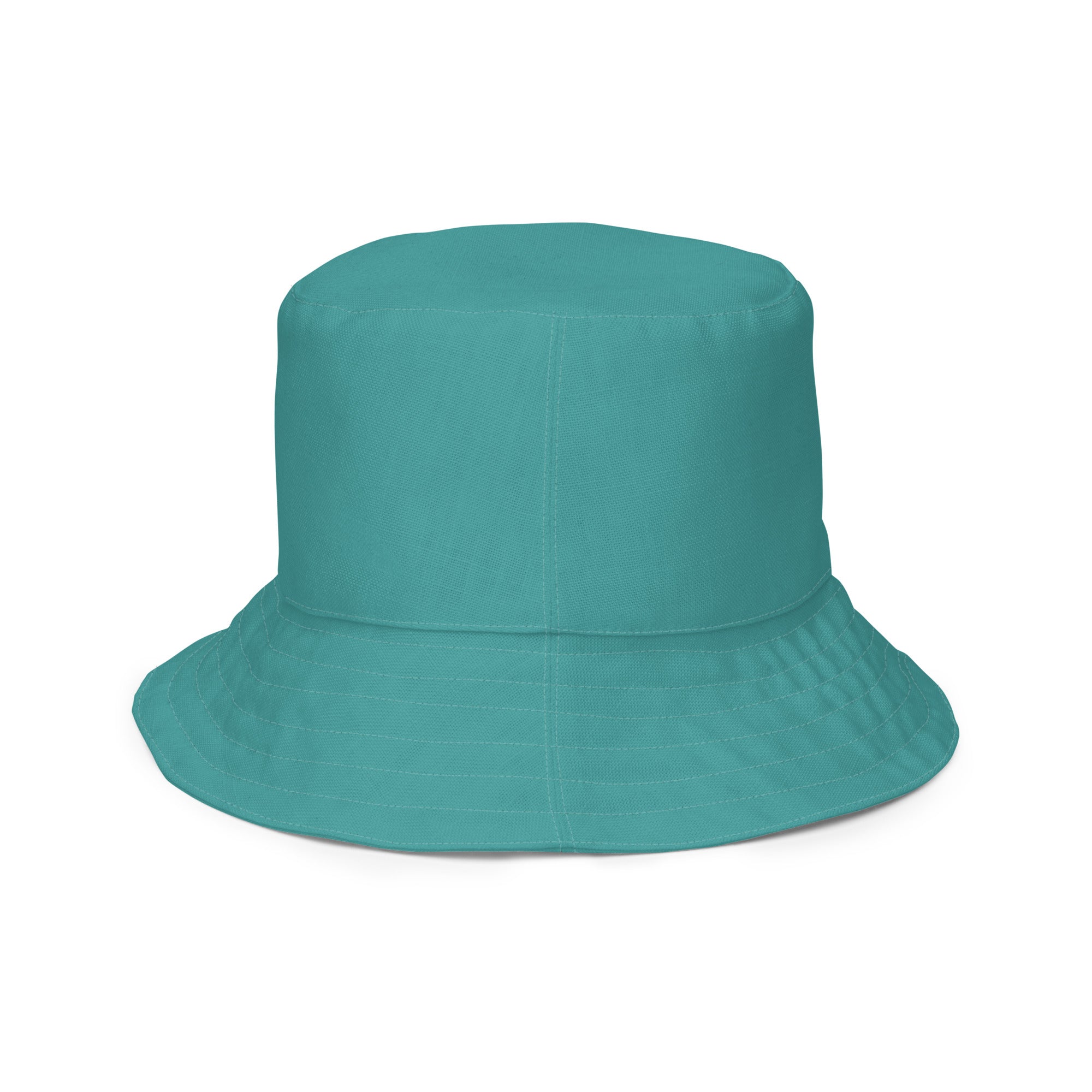 Reversible Bucket Hat in Teal Green showcasing its dual-sided design and wide brim for sun protection.