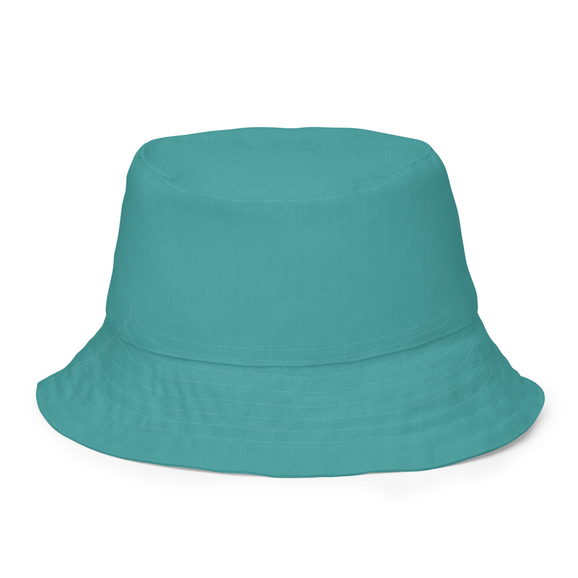 Reversible Bucket Hat in Teal Green showcasing its dual-sided design and wide brim for sun protection.