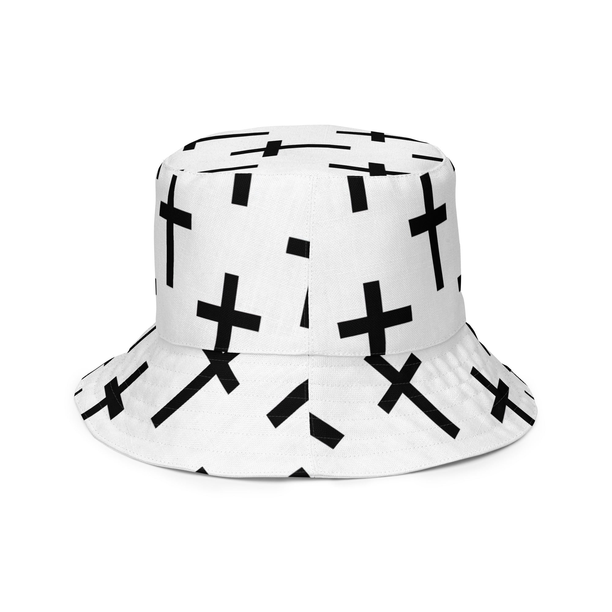 Reversible bucket hat featuring a white and black cross print, showcasing its stylish design and premium fabric.