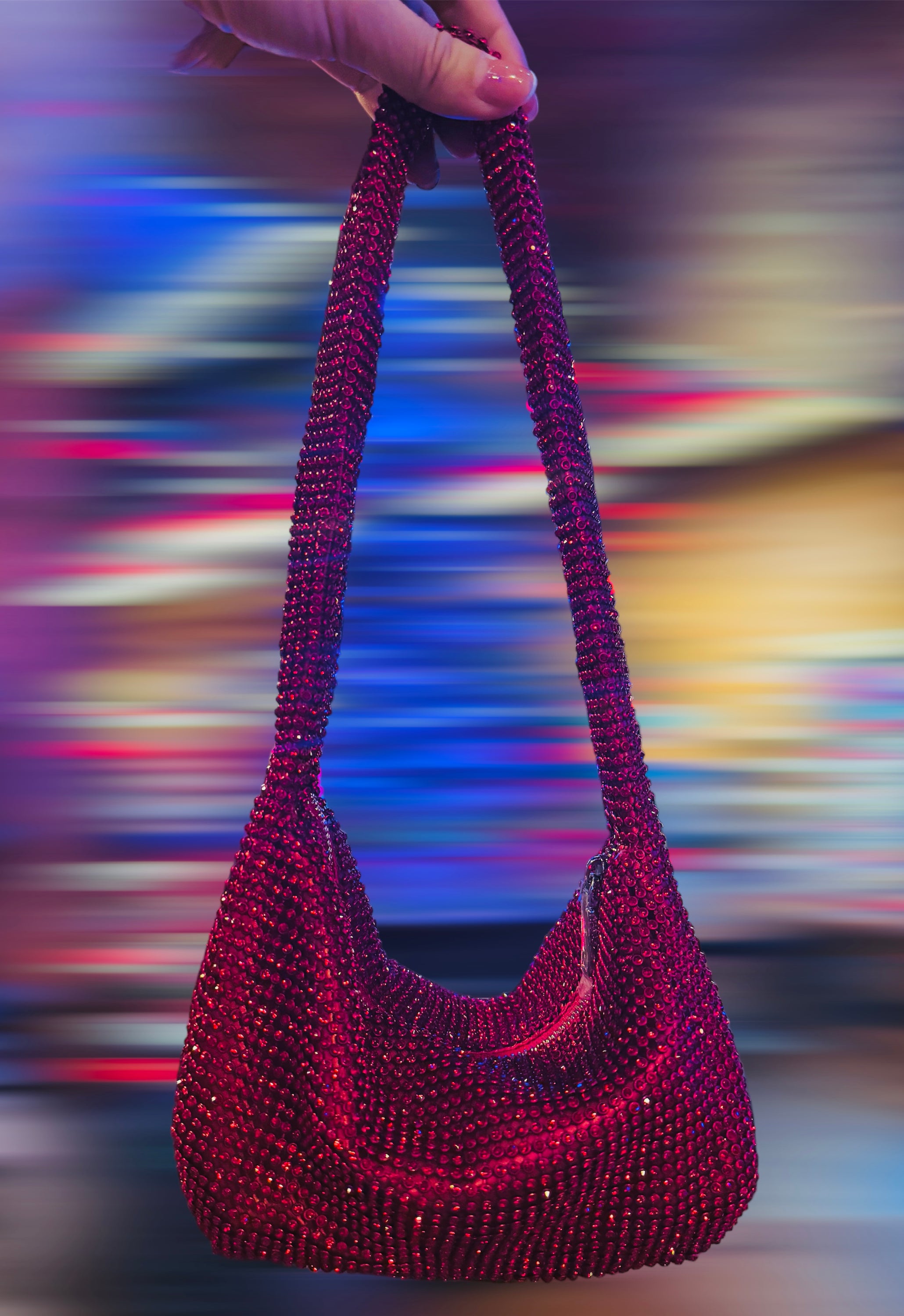 A stylish Rhinestone Mini Shoulder Bag featuring sparkling rhinestones and silver-tone accents, available in silver, red, and green.