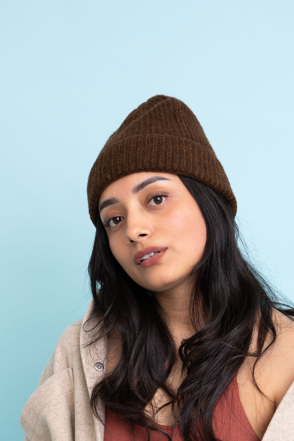 A cozy Rib Knit Cuffed Beanie in various colors, showcasing its soft texture and stylish cuff detail.