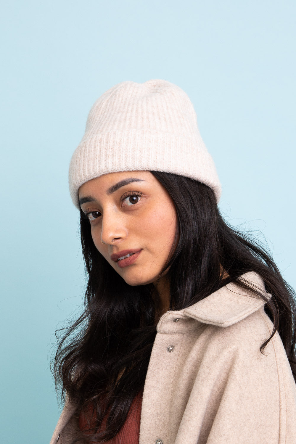 A cozy Rib Knit Cuffed Beanie in various colors, showcasing its soft texture and stylish cuff detail.