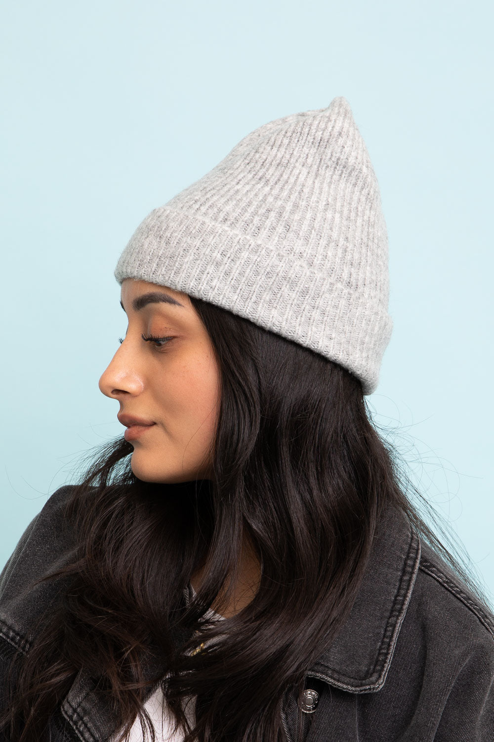 A cozy Rib Knit Cuffed Beanie in various colors, showcasing its soft texture and stylish cuff detail.