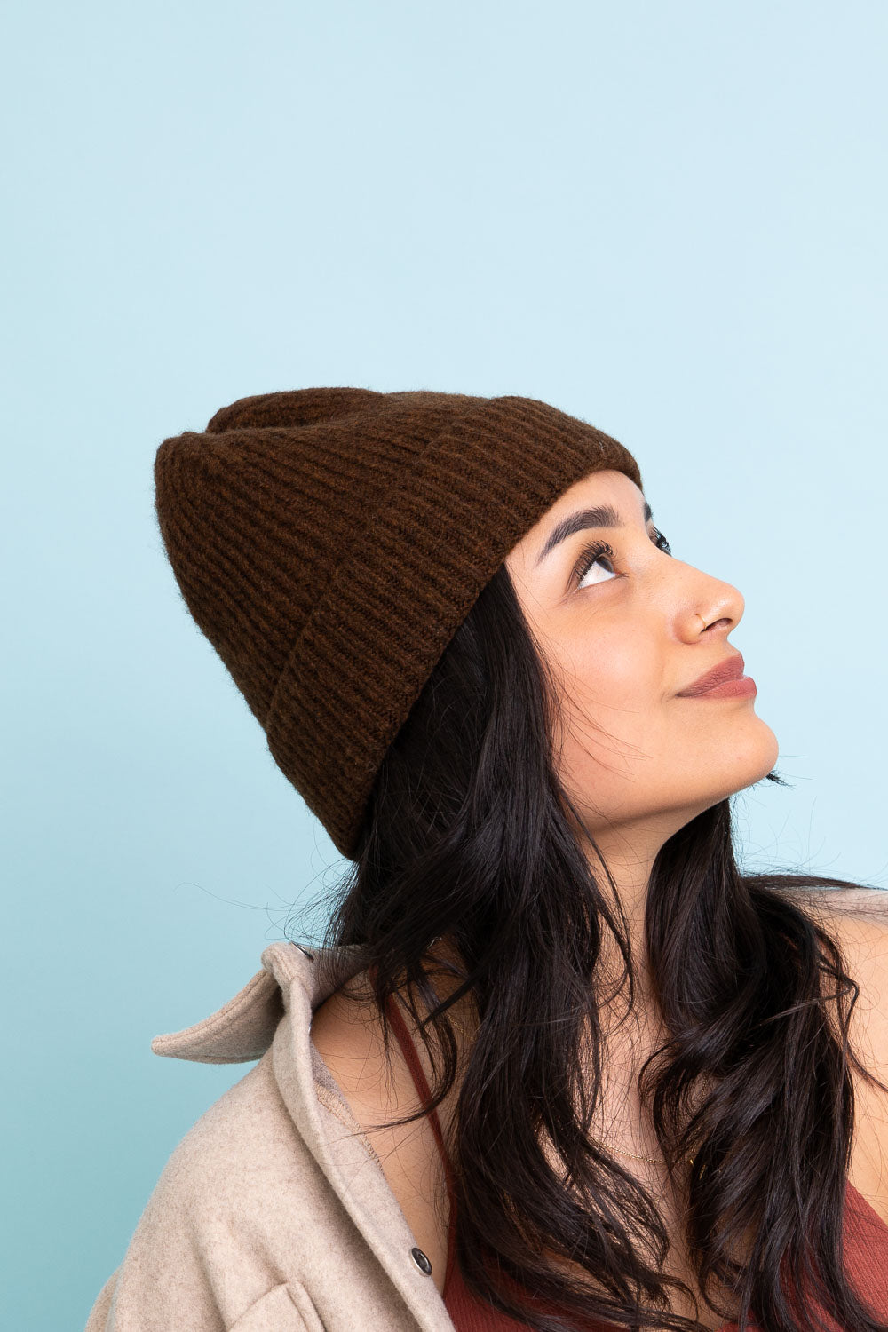 A cozy Rib Knit Cuffed Beanie in various colors, showcasing its soft texture and stylish cuff detail.