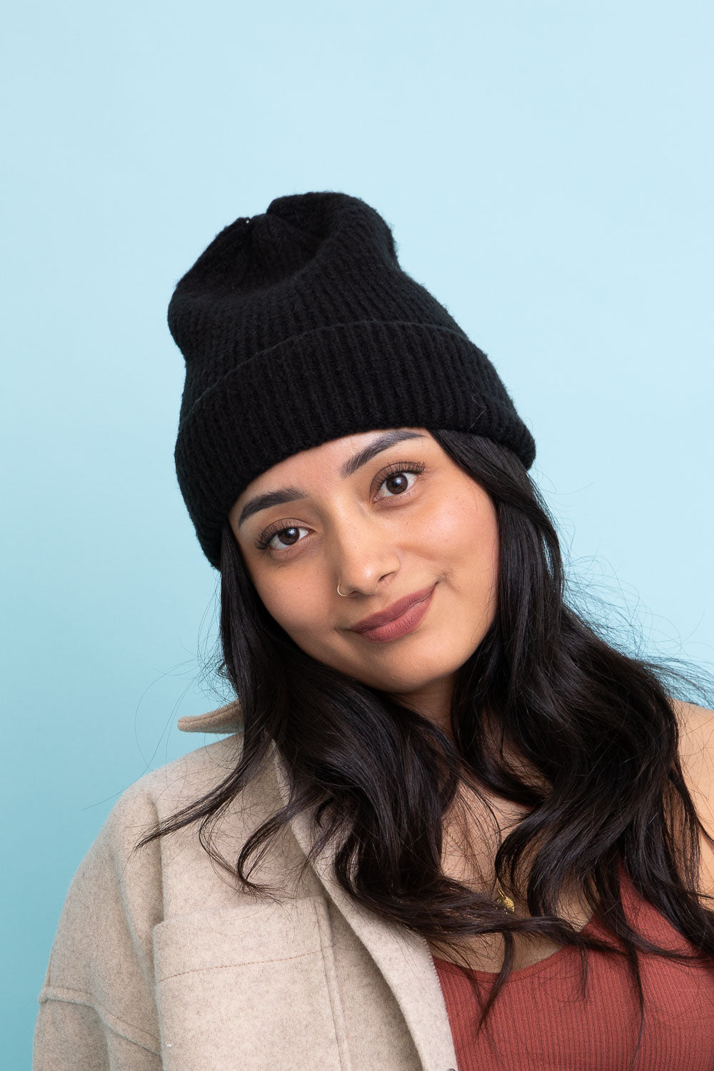 A cozy Rib Knit Cuffed Beanie in various colors, showcasing its soft texture and stylish cuff detail.