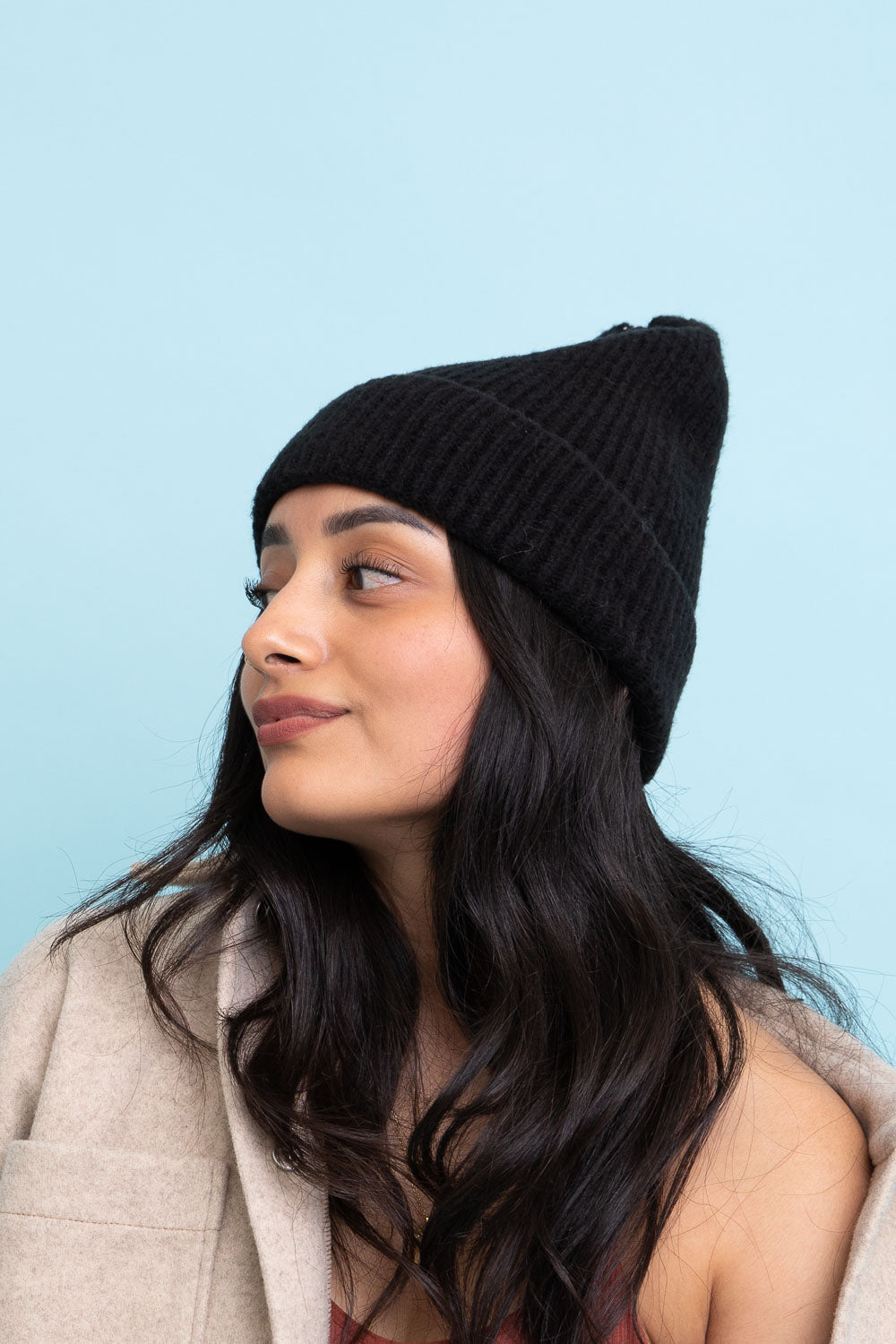 A cozy Rib Knit Cuffed Beanie in various colors, showcasing its soft texture and stylish cuff detail.