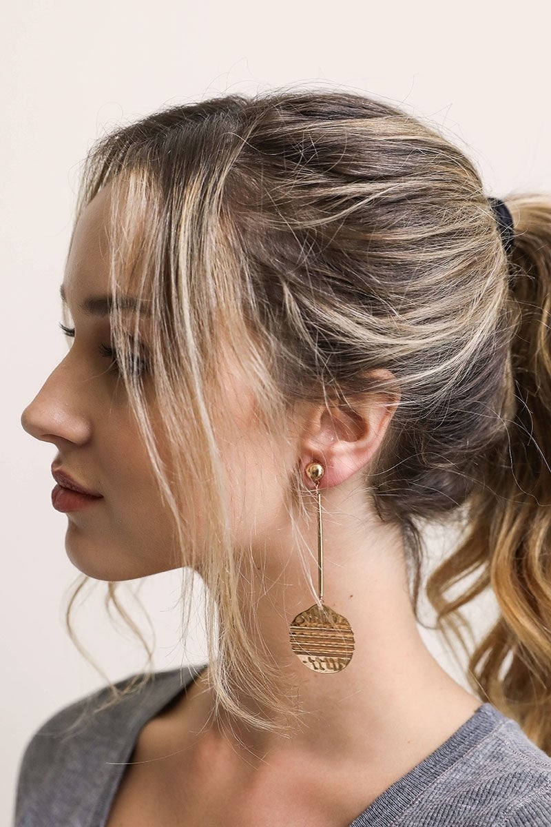 Elegant Roman Coin Earrings featuring a dangle drop design with intricate coin details, perfect for enhancing any outfit.