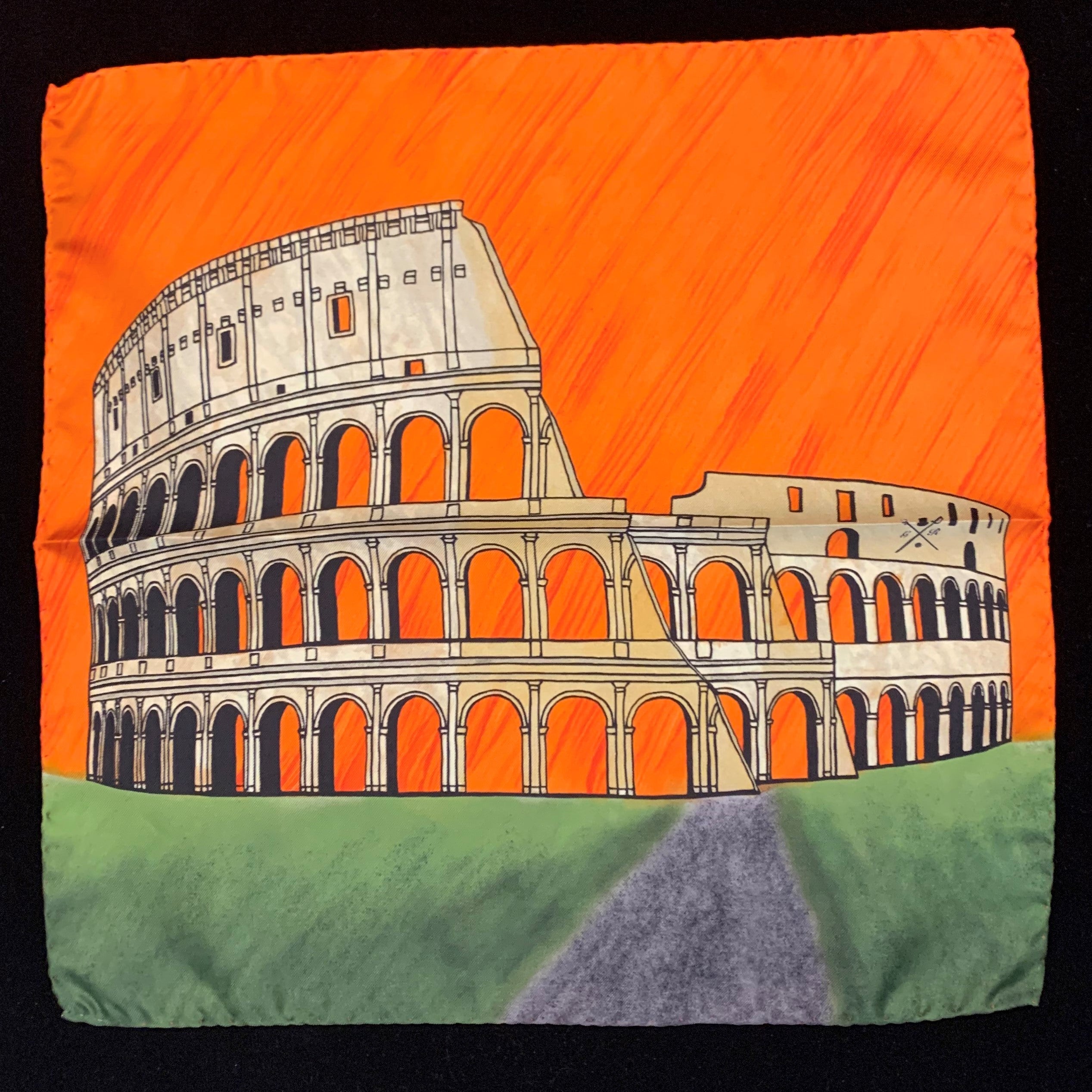 Rome Colosseum Orange Pocket Square featuring hand-sketched design in vibrant colors of orange, gold, green, and sandstone on luxurious silk.