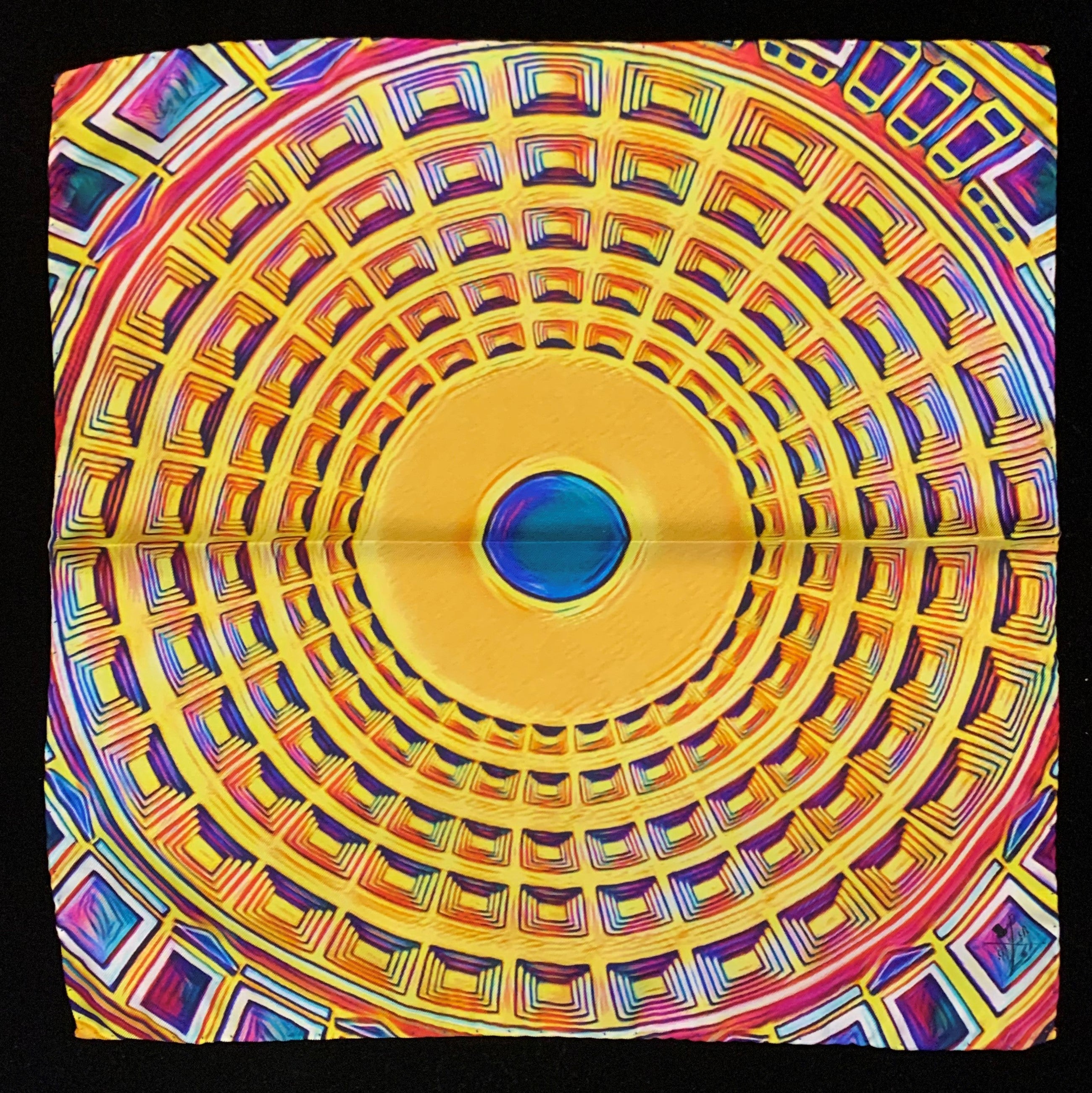 A vibrant silk pocket square featuring the Pantheon ceiling design in shades of yellow, gold, pink, blue, and purple.