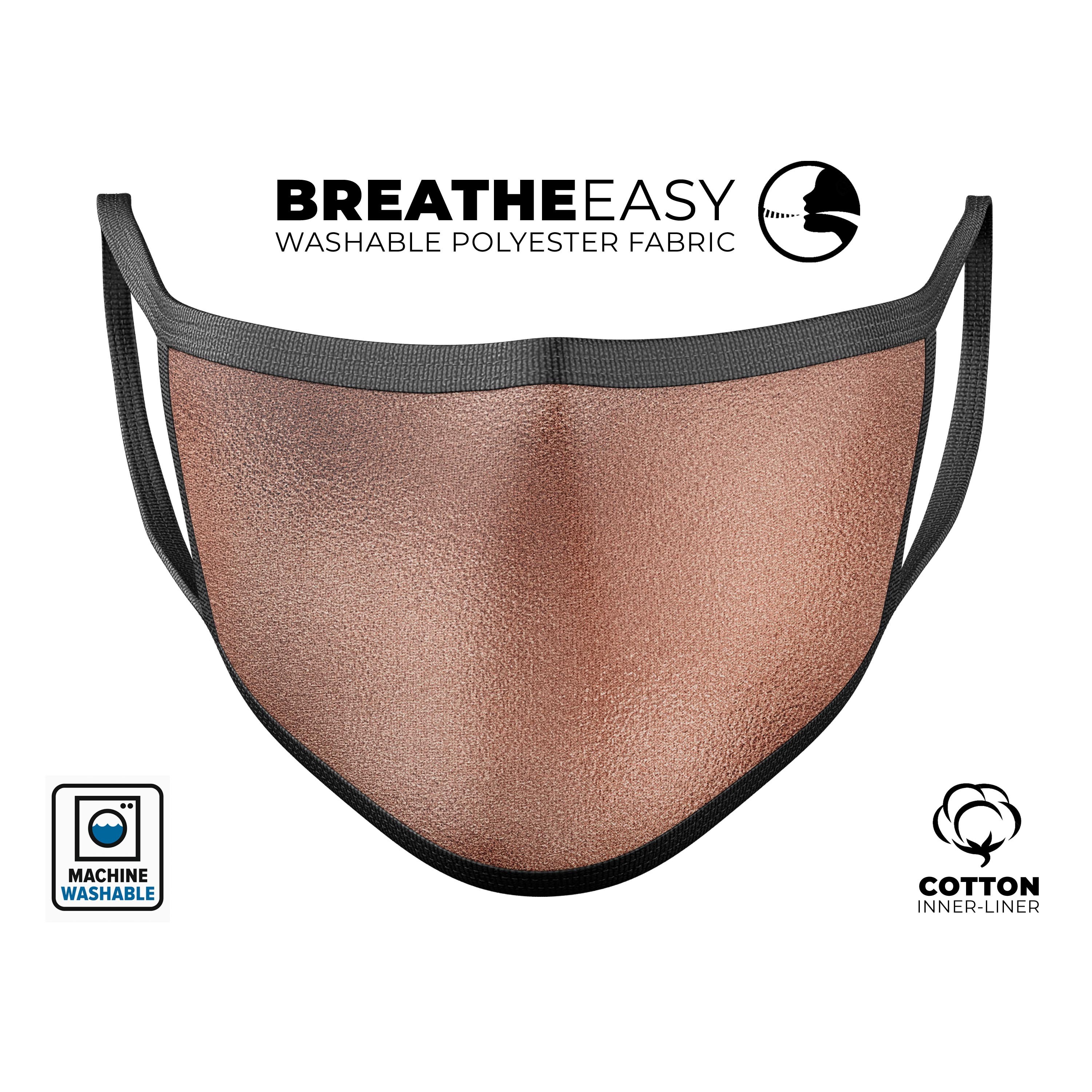 Rose Gold Digital Foiled Surface V1 mouth cover, showcasing a stylish design with adjustable ear loops, made in the USA.