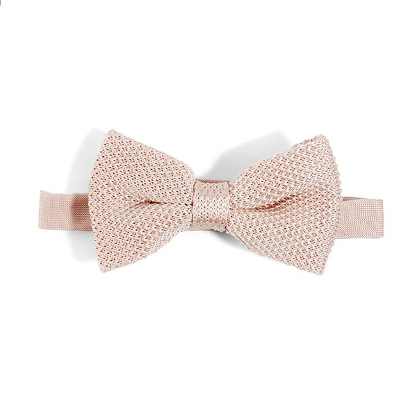 Rose quartz knitted bow tie showcasing its elegant design and texture.