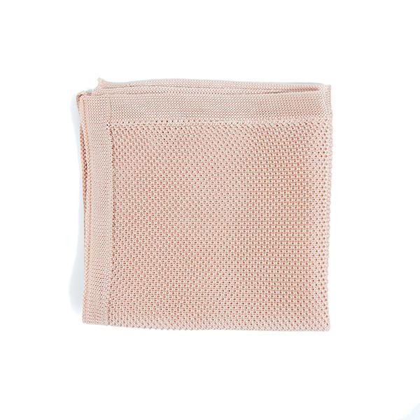 Rose quartz knitted pocket square displayed elegantly, showcasing its soft texture and beautiful color.