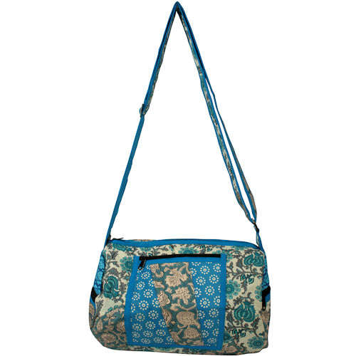 Round Patchwork Sports Bag with zipper pockets and adjustable strap, handmade by youth artisans at Lakshya shelter in India.