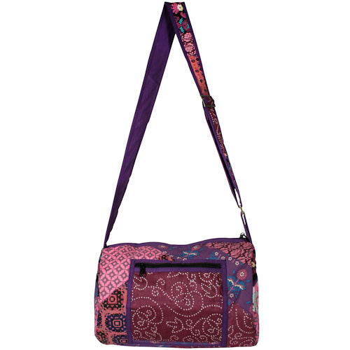 Round Patchwork Sports Bag with zipper pockets and adjustable strap, handmade by youth artisans at Lakshya shelter in India.