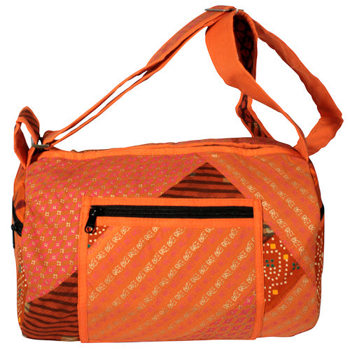 Round Patchwork Sports Bag with zipper pockets and adjustable strap, handmade by youth artisans at Lakshya shelter in India.