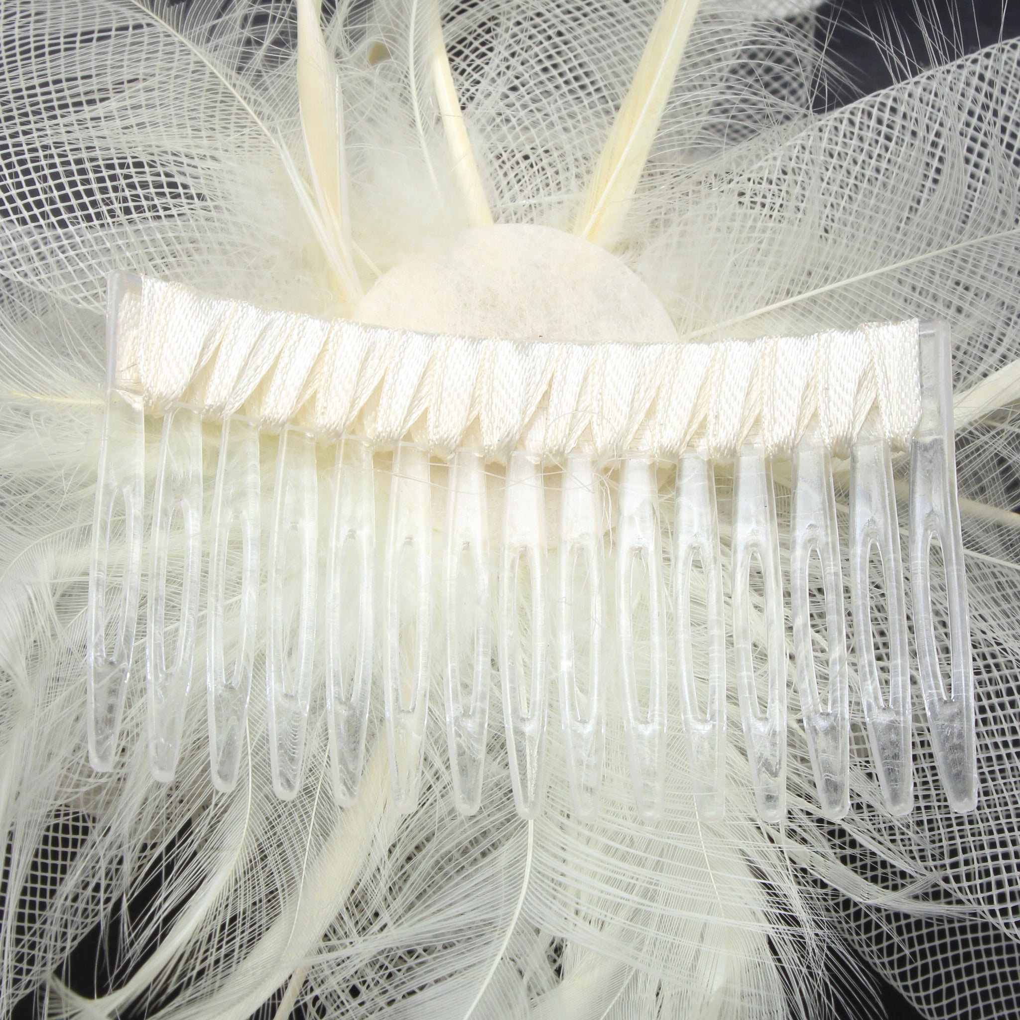 Ruby Rocks Grace Fascinator in cream featuring organza and faux feathers, elegantly designed for special occasions.