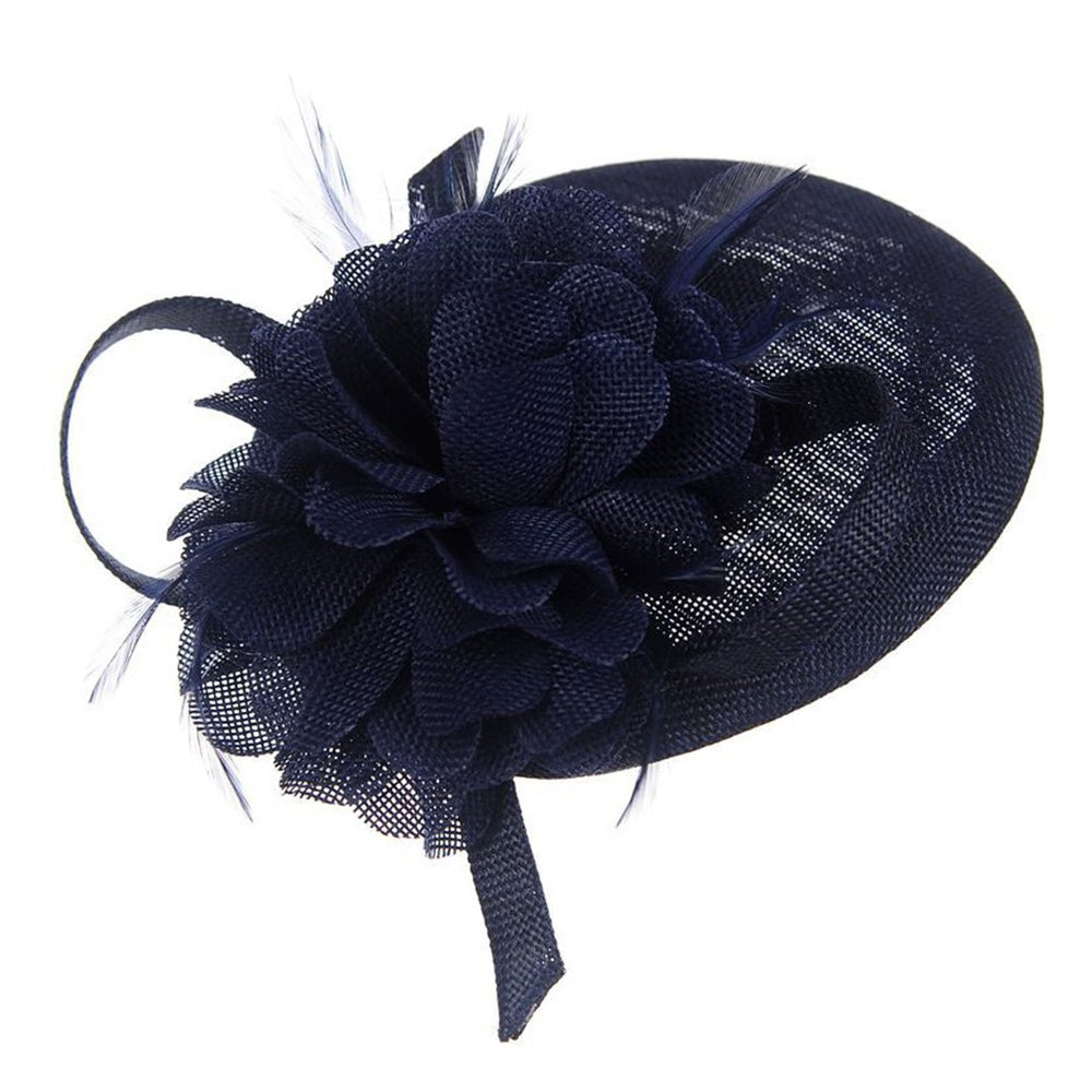 Ruby Rocks Jolan Fascinator in Navy featuring a flower design with feathers and a bow, attached with a hair clip.