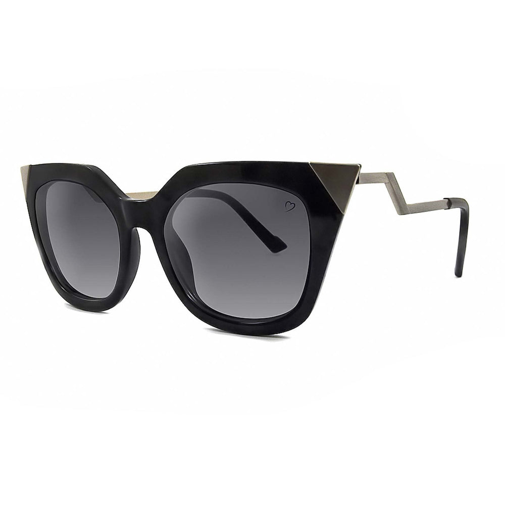 Ruby Rocks Mykonos sunglasses in black with metal tips and angled temples, featuring a love heart logo on the lens.