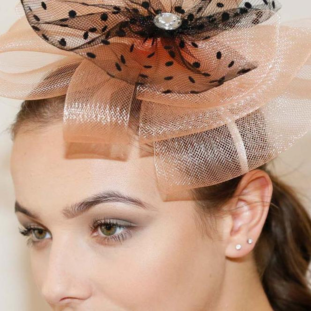 Ruby Rocks Pedra Fascinator in Peach featuring a flower and spotted net on a comfortable headband.