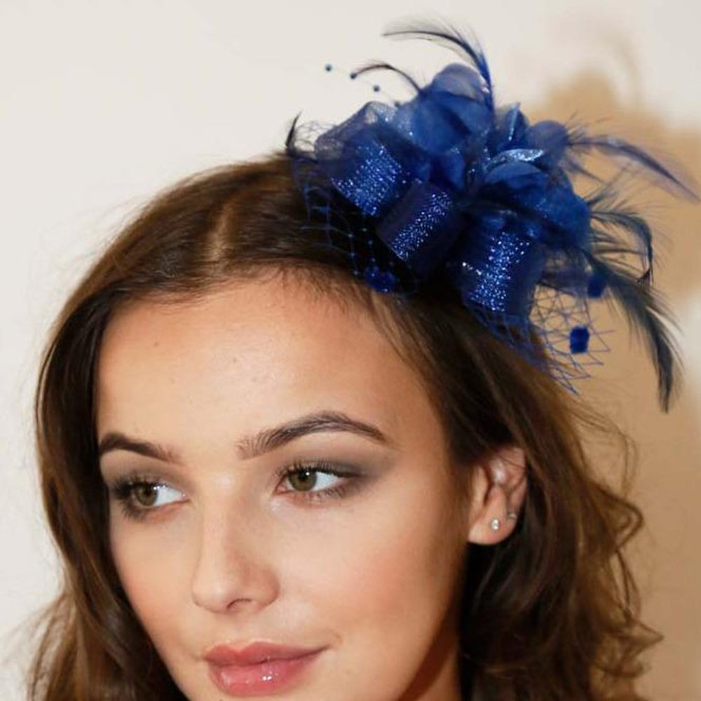 Ruby Rocks Vida Fascinator in Blue featuring flowers, feathers, and beads, designed as a hairclip and brooch.