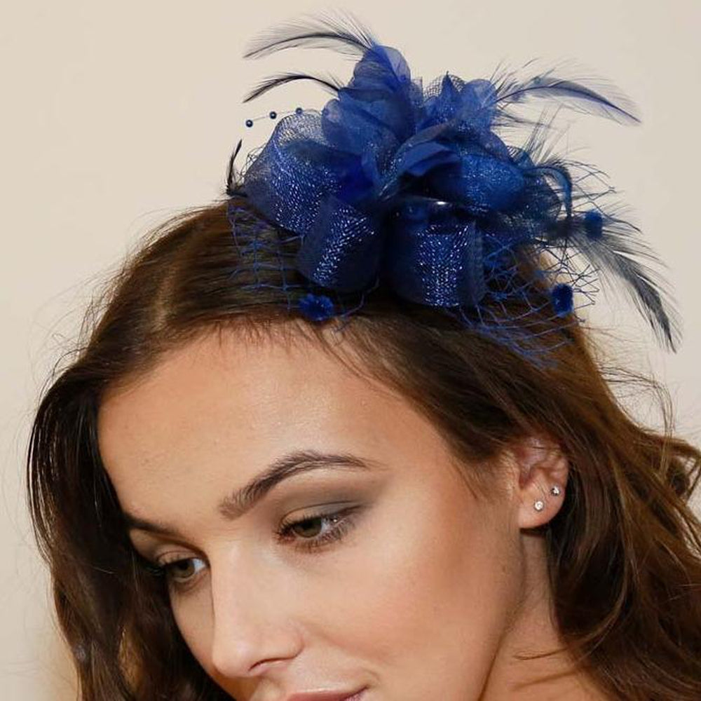 Ruby Rocks Vida Fascinator in Blue featuring flowers, feathers, and beads, designed as a hairclip and brooch.