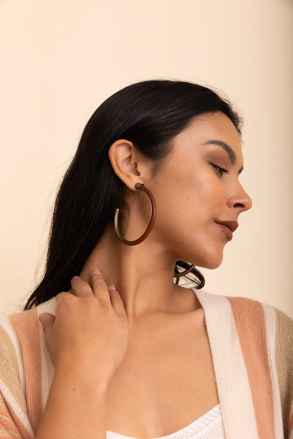 Rustic Charm Leather & Brass Hoop Earrings featuring a unique leather and brass design, perfect for trendy outfits.