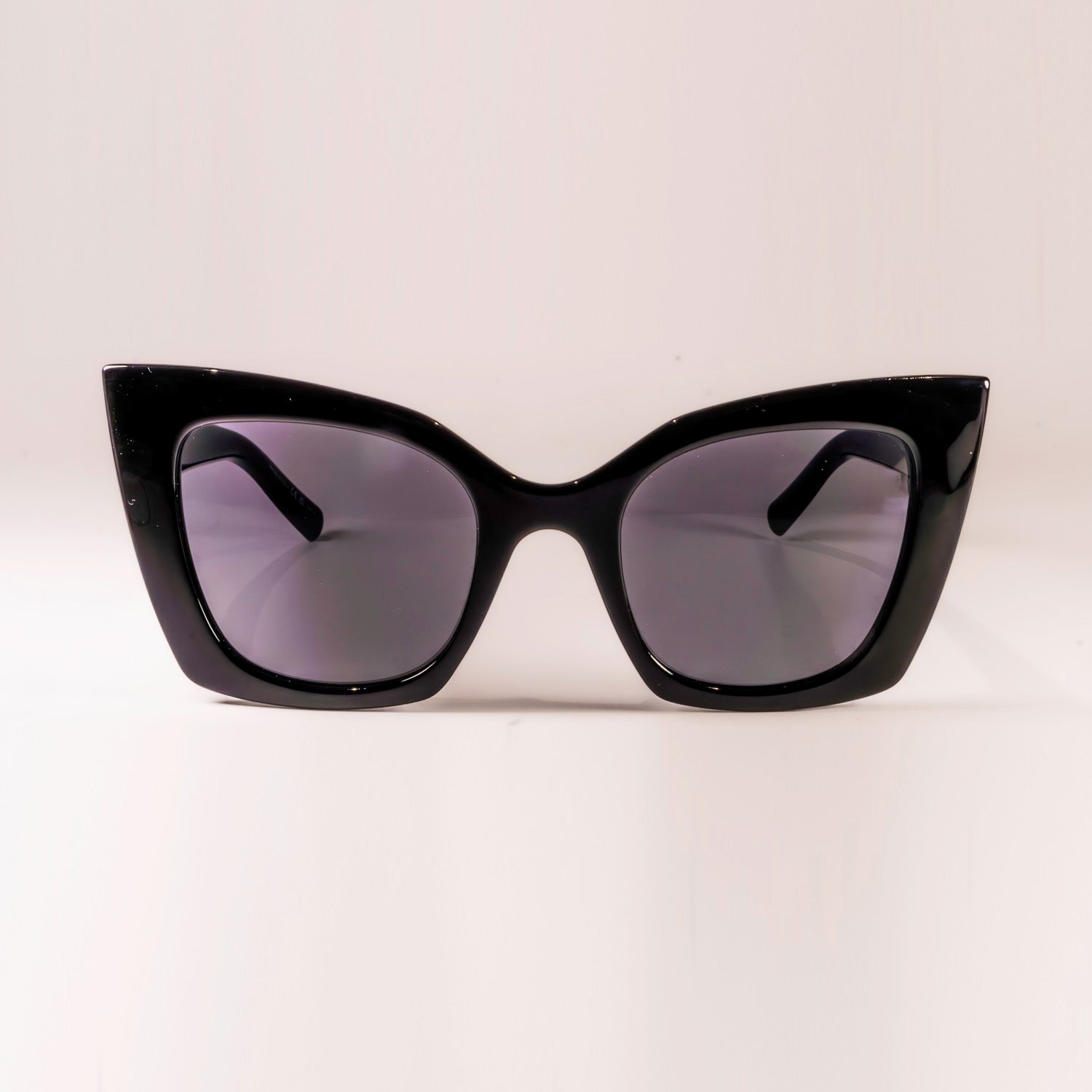 Saint Laurent SL-552 - 001 sunglasses featuring a butterfly shape, metal frame, and nylon lenses, designed for women.