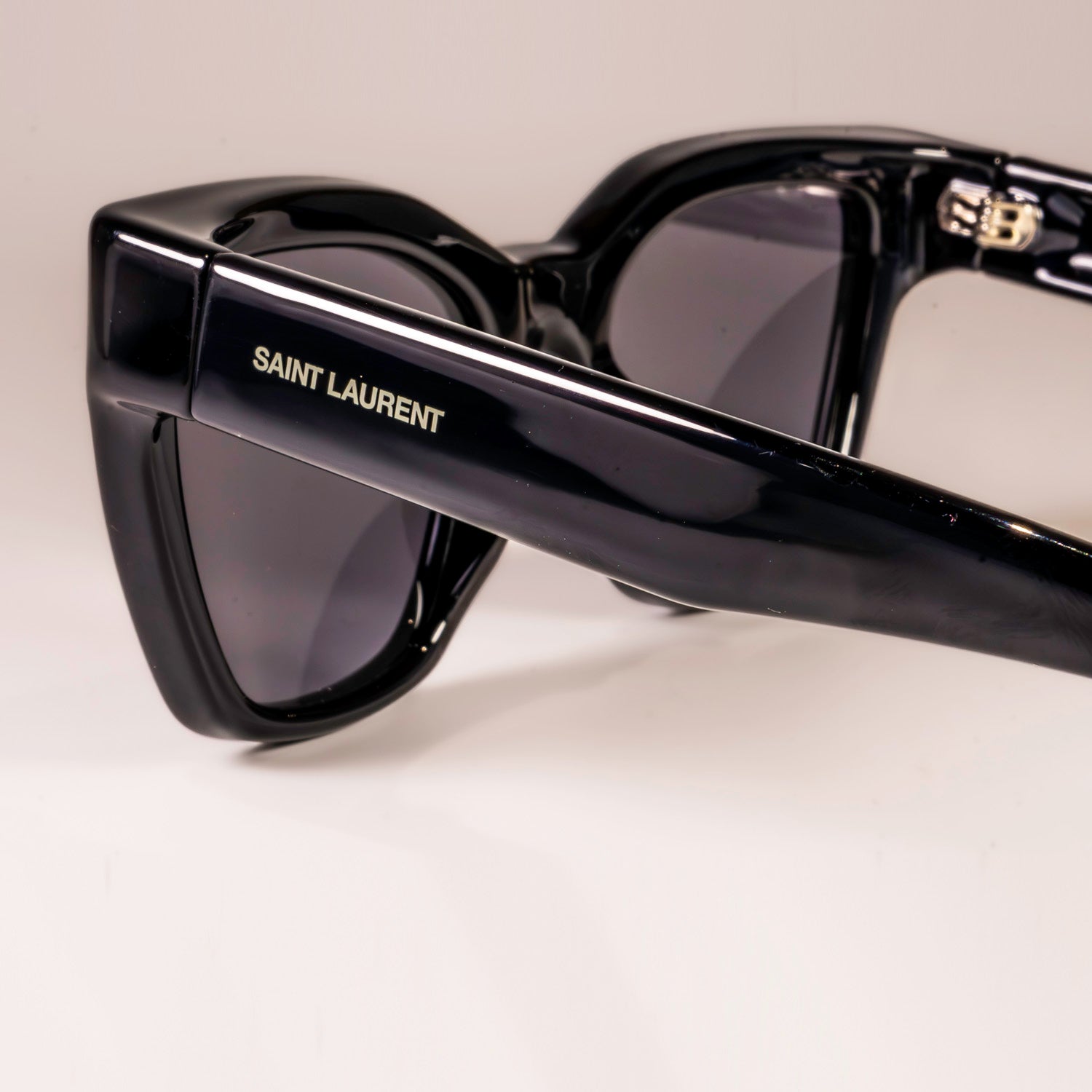 Saint Laurent Sunglasses SL-641 featuring a square black acetate frame and black lenses with logo engraving.