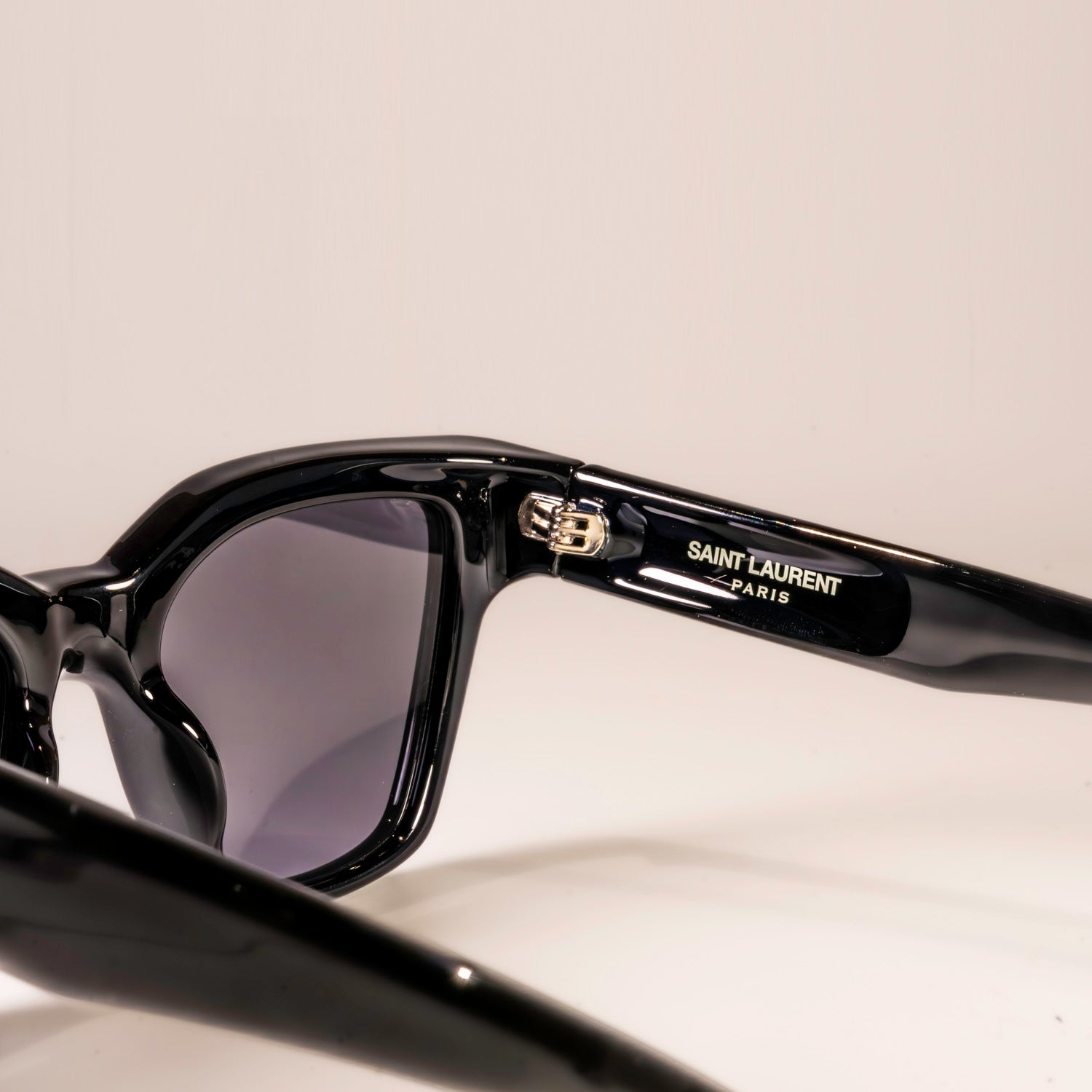 Saint Laurent Sunglasses SL-641 featuring a square black acetate frame and black lenses with logo engraving.