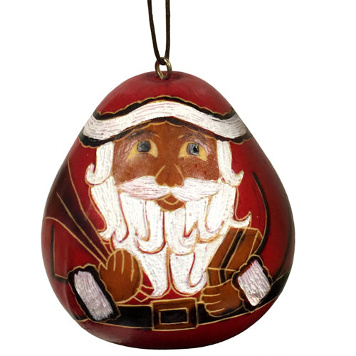 Hand-carved Santa Claus gourd ornament, showcasing intricate designs and natural textures, perfect for Christmas decor.